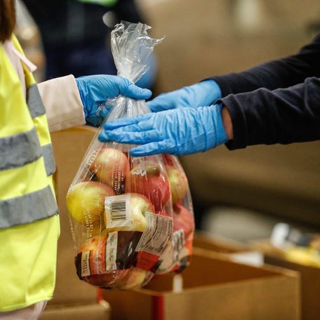 Volunteers distribute food during a Giving Tuesday event at a food bank in Indianapolis in 2020.