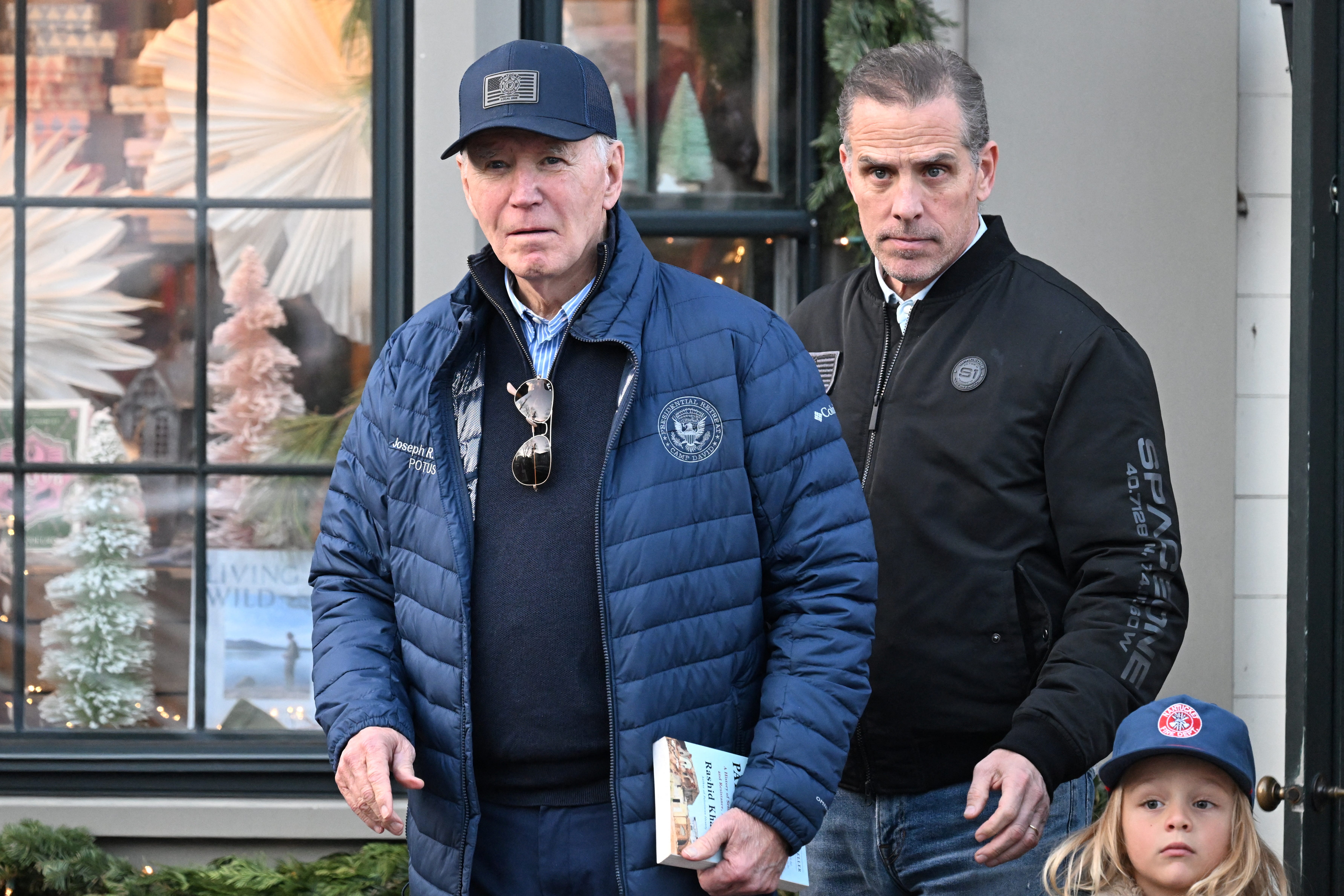 President Joe Biden, accompanied by Hunter Biden and Beau Jr., walks out of a bookstore in downtown Nantucket, Massachusetts, U.S., November 29, 2024.