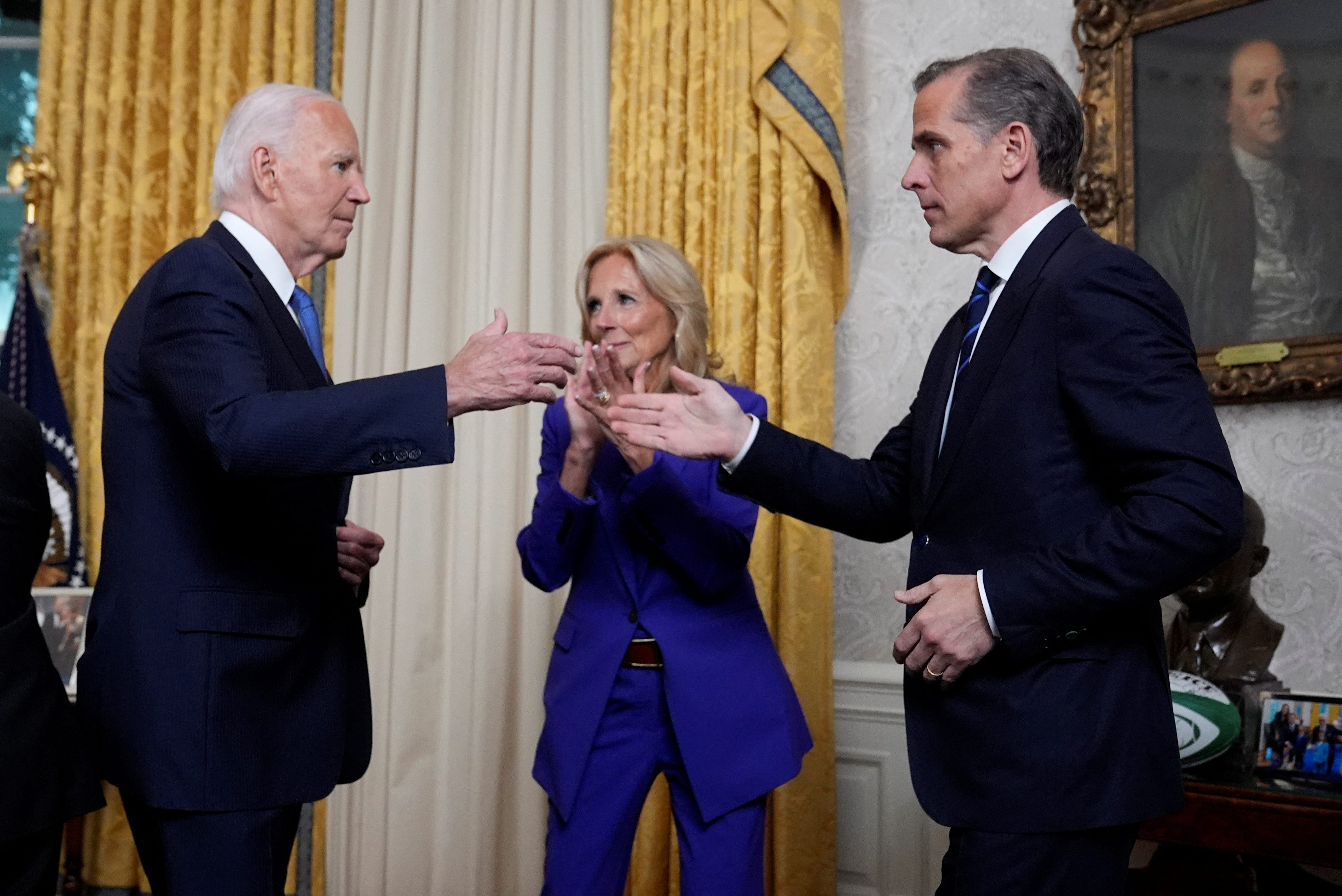 U.S. President Joe Biden greets his son Hunter Biden after addressing the nation from the Oval Office of the White House in Washington, Wednesday, July 24, 2024, about his decision to drop his Democratic presidential reelection bid, as first lady Jill Biden watches.