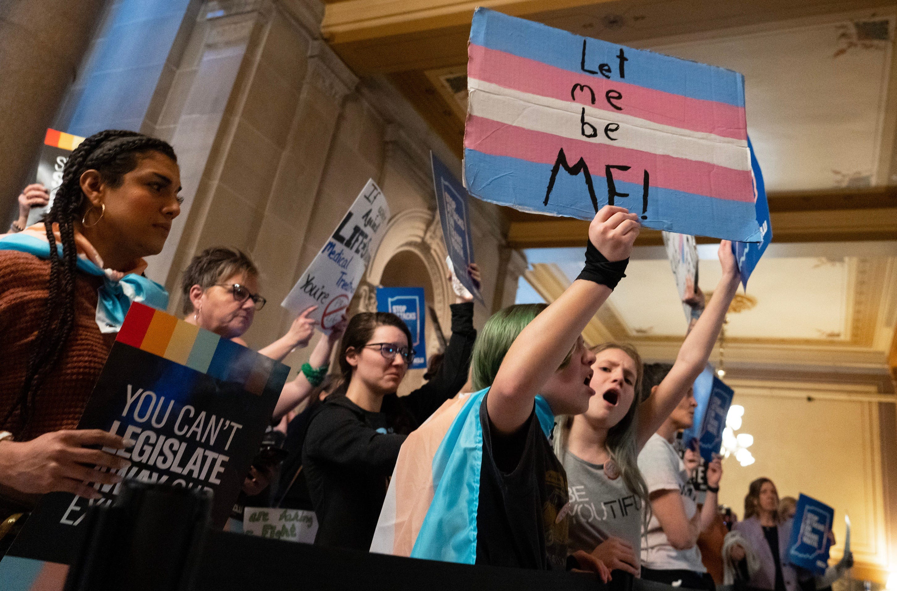 People protest a ban on affirming care for transgender youth in 2023 at the Indiana Capitol in Indianapolis.