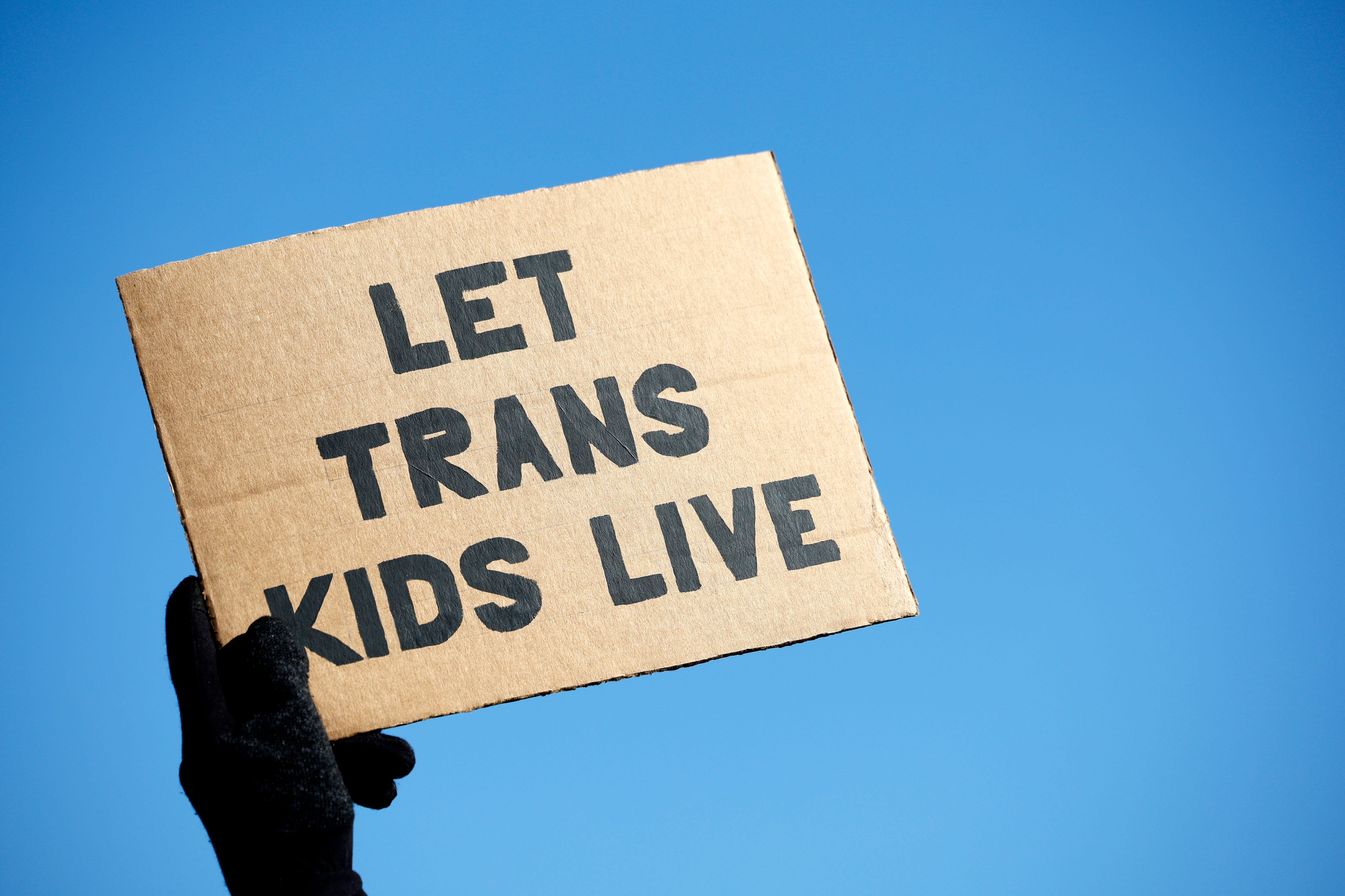 A transgender rights supporter takes part in a rally outside of the U.S. Supreme Court as the high court hears arguments in a case on transgender health rights on Dec. 4, 2024 in Washington, DC. The Supreme Court is hearing arguments in US v. Skrmetti, a case about Tennessee's law banning gender-affirming care for minors and if it violates the Constitution's equal protection guarantee.