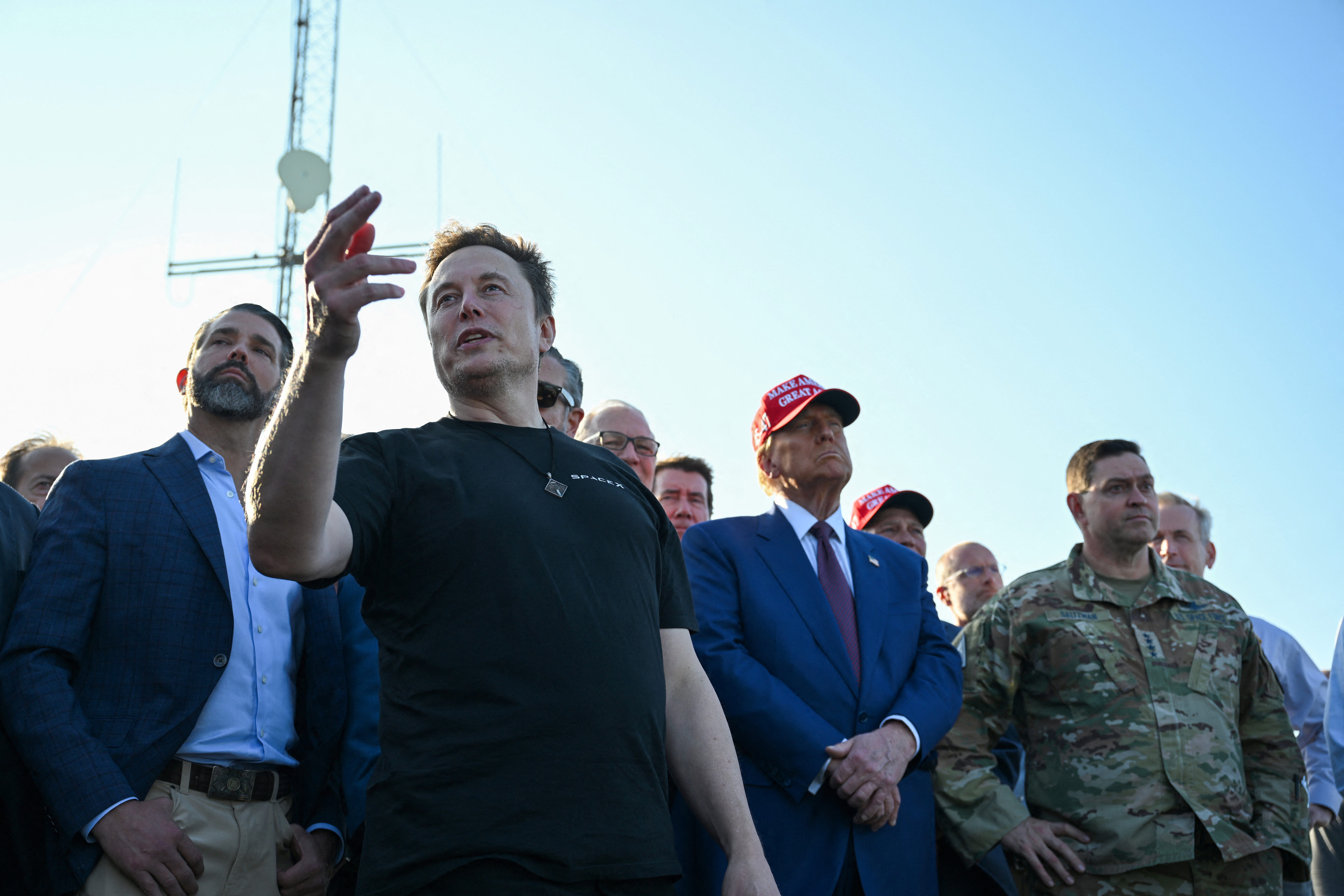 Elon Musk speaks with guests including Donald Trump Jr. and U.S. President-elect Donald Trump at a viewing of the launch of the sixth test flight of the SpaceX Starship, in Brownsville, Texas, U.S., November 19, 2024 . Brandon Bell/Pool via REUTERS