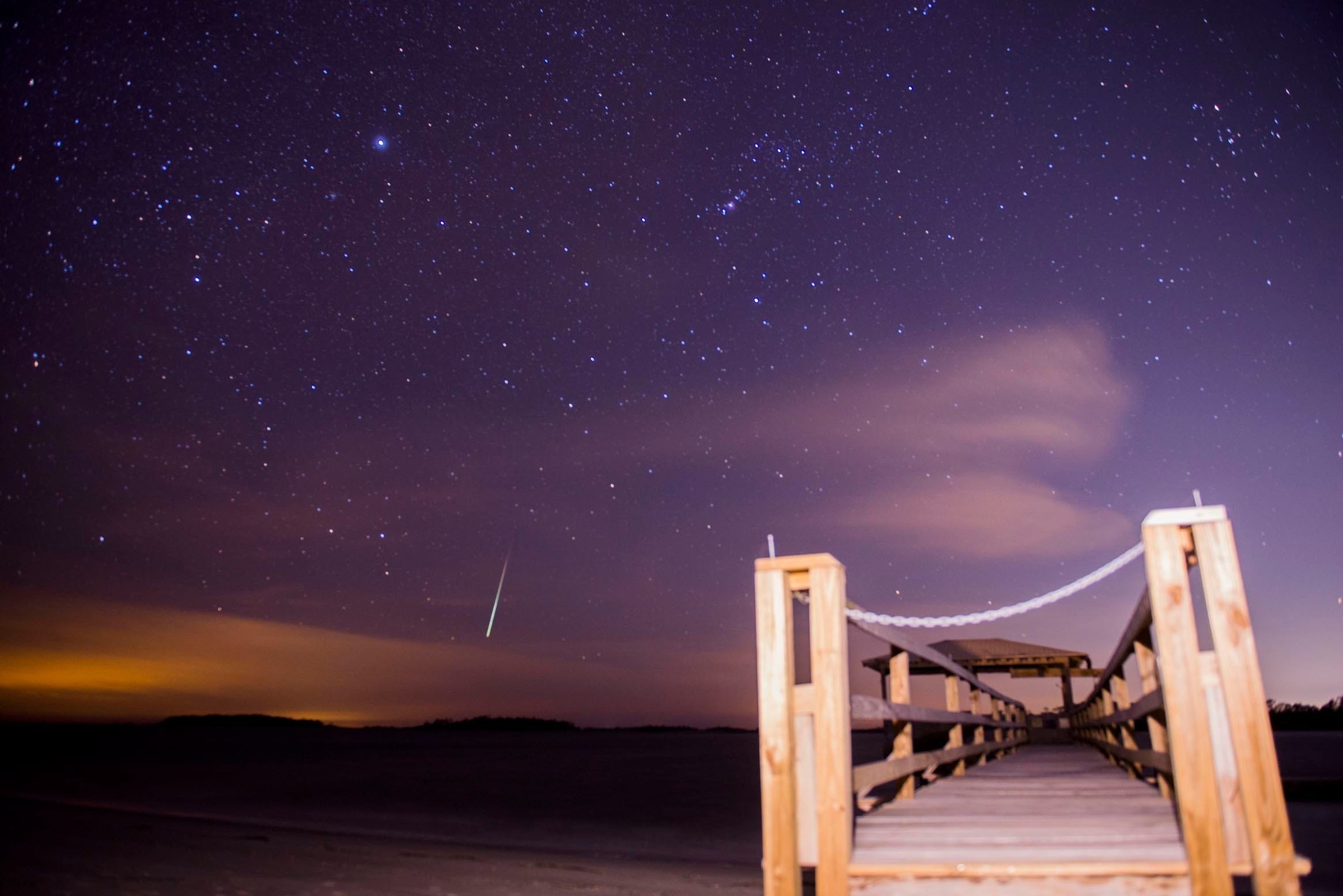 The Geminid meteor shower lights up the night sky in December 2017 above Tybee Island in Georgia. The year's best meteor shower, the Geminids, peak Dec. 12.