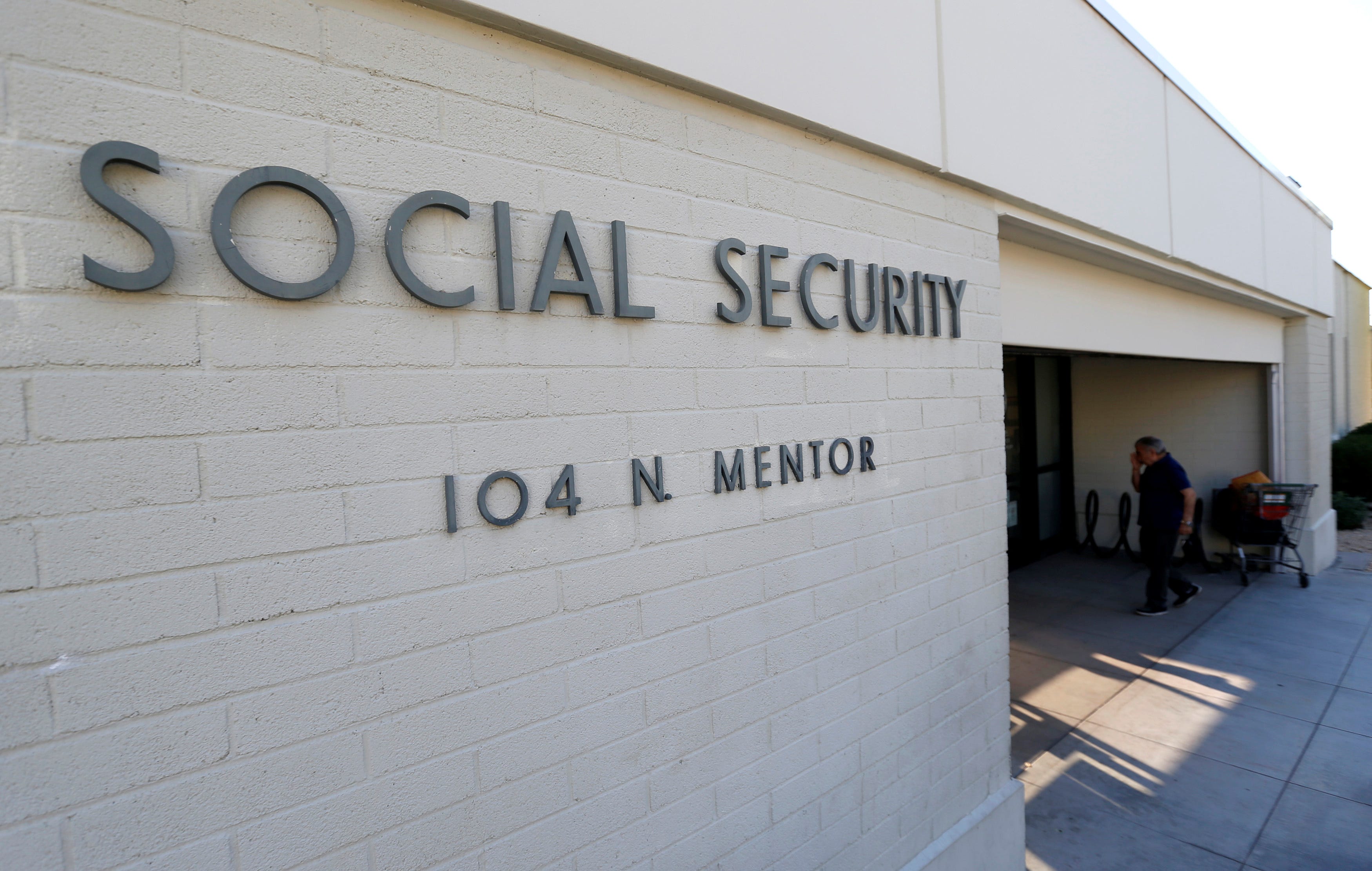 A person walks into a Social Security Office in Pasadena, California U.S., March 14, 2017. REUTERS/Mario Anzuoni