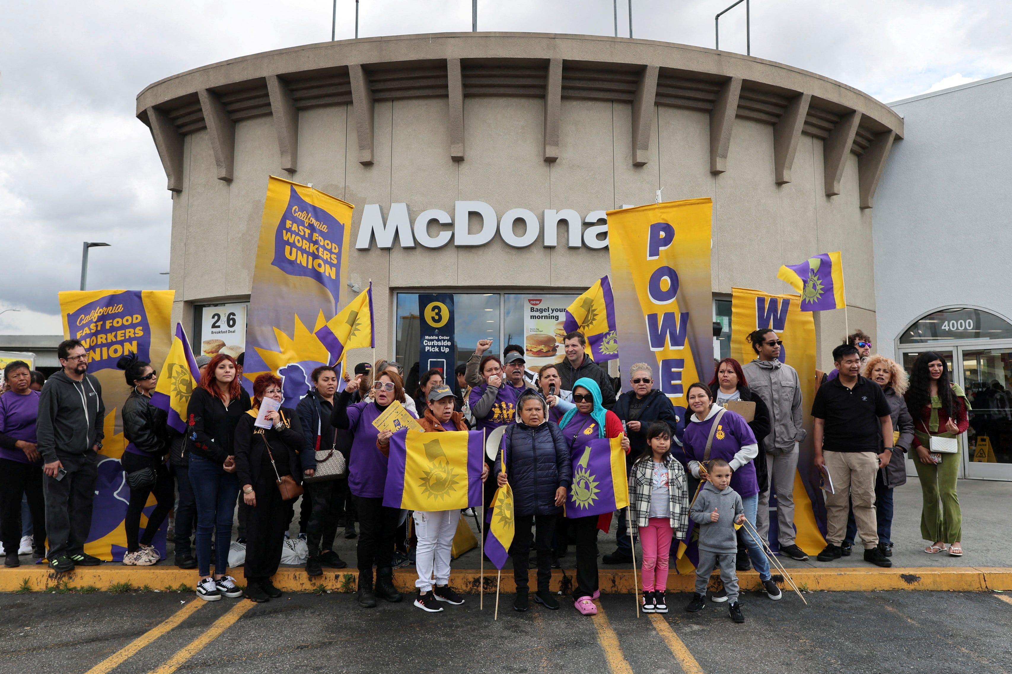California fast food workers hold a rally as they celebrate their minimum wage increase to $20 an hour during an event in Los Angeles, California, U.S., April 5, 2024.