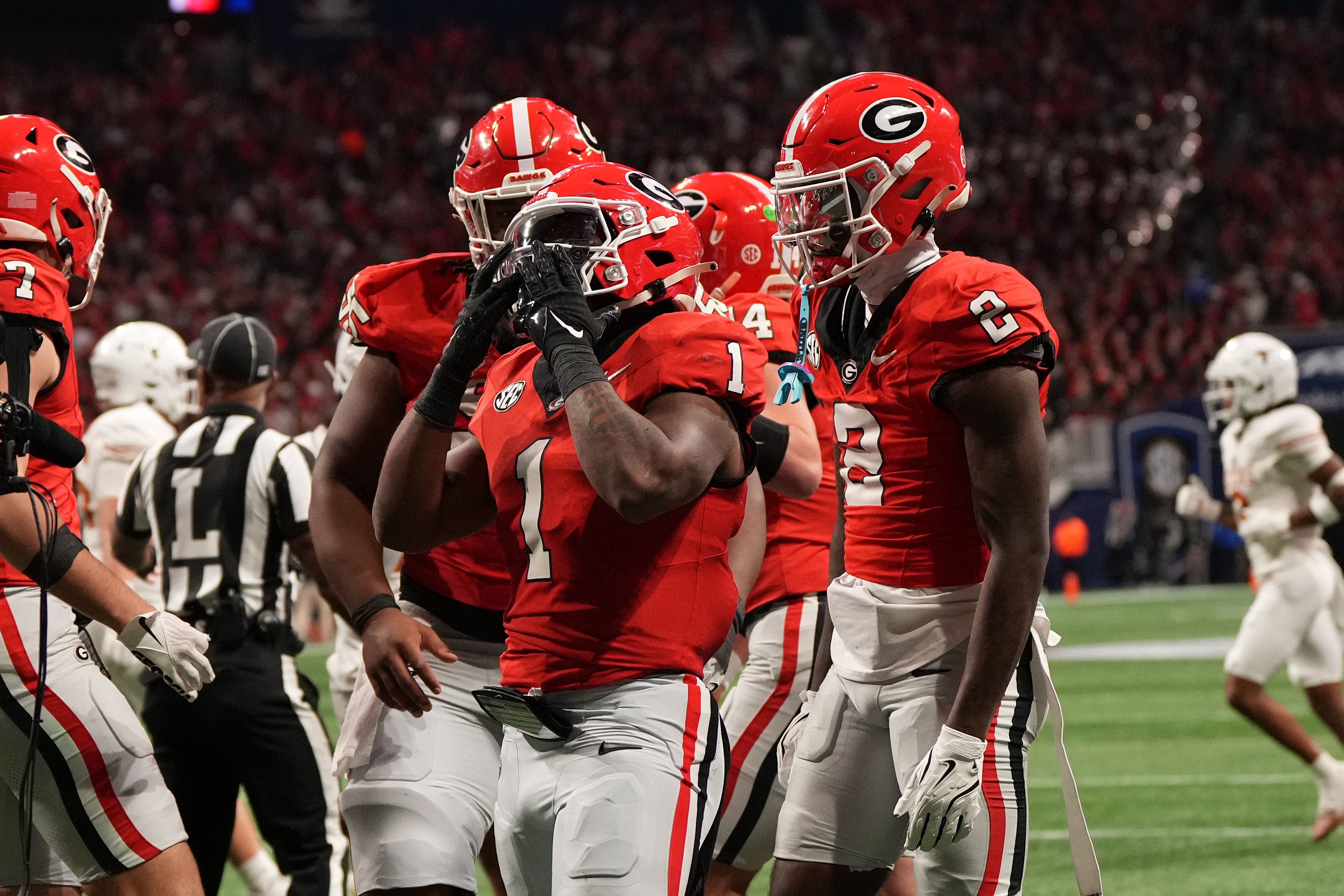 Georgia running back Trevor Etienne (1) reacts after rushing for a touchdown against Texas during the second half in the 2024 SEC championship game at Mercedes-Benz Stadium in Atlanta.