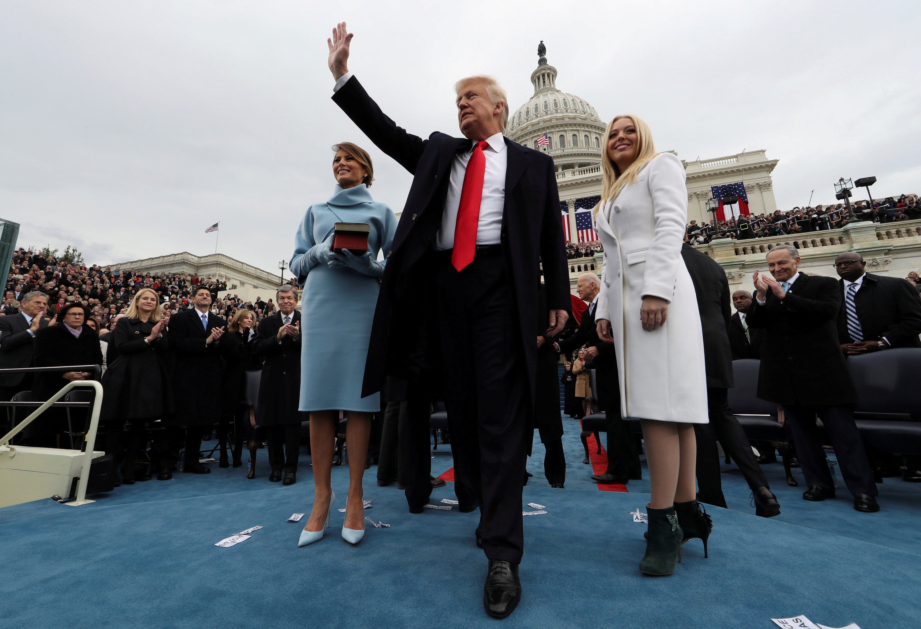 U.S. President Donald Trump acknowledges the audience after taking the oath of office as his wife Melania (L) and daughter Tiffany watch during inauguration ceremonies swearing in Trump as the 45th president of the United States on the West Front of the U.S. Capitol in Washington, DC, U.S., January 20, 2017.