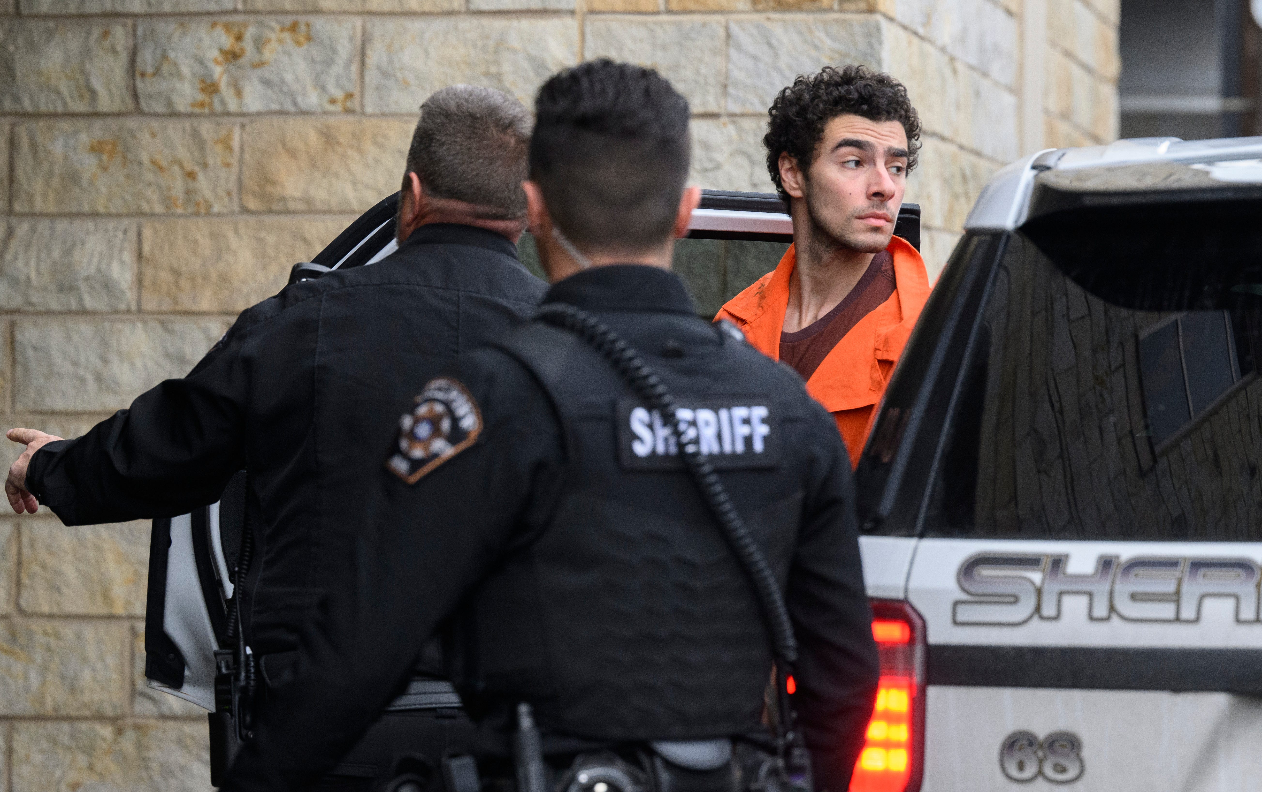 HOLLIDAYSBURG, PENNSYLVANIA - DECEMBER 10: Suspected shooter Luigi Mangione is led into the Blair County Courthouse for an extradition hearing December 10, 2024 in Hollidaysburg, Pennsylvania. Mangione has been arraigned on weapons and false identification charges related to the fatal shooting of United Healthcare CEO Brian Thompson in New York City. Mangione is incarcerated in the State Correctional Institution in Huntingdon, Pennsylvania awaiting extradition   to New York. (Photo by Jeff Swensen/Getty Images) *** BESTPIX *** ORG XMIT: 776252189 ORIG FILE ID: 2188645013