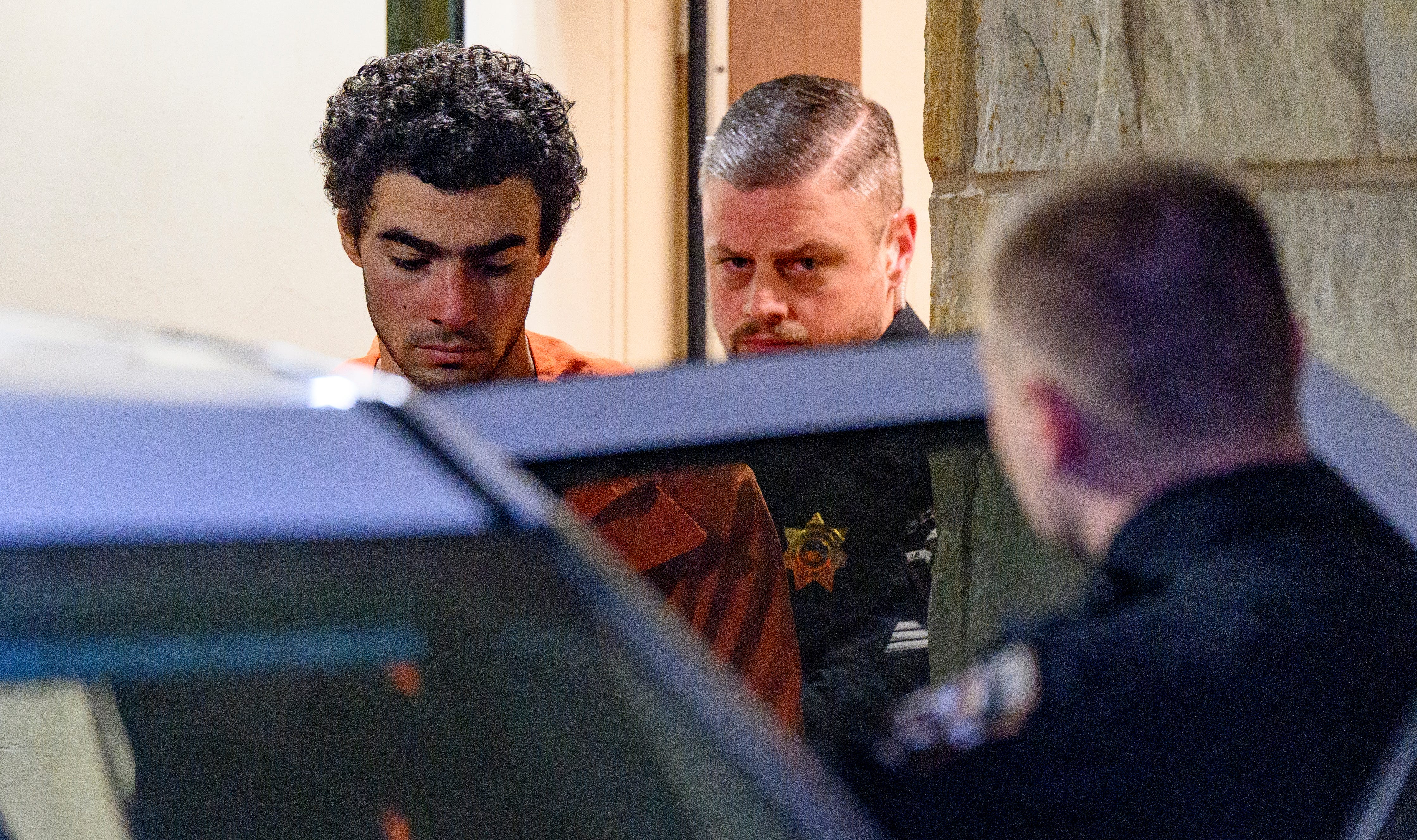Suspected shooter Luigi Mangione is led from the Blair County Courthouse after an extradition hearing December 10, 2024 in Hollidaysburg, Pennsylvania.