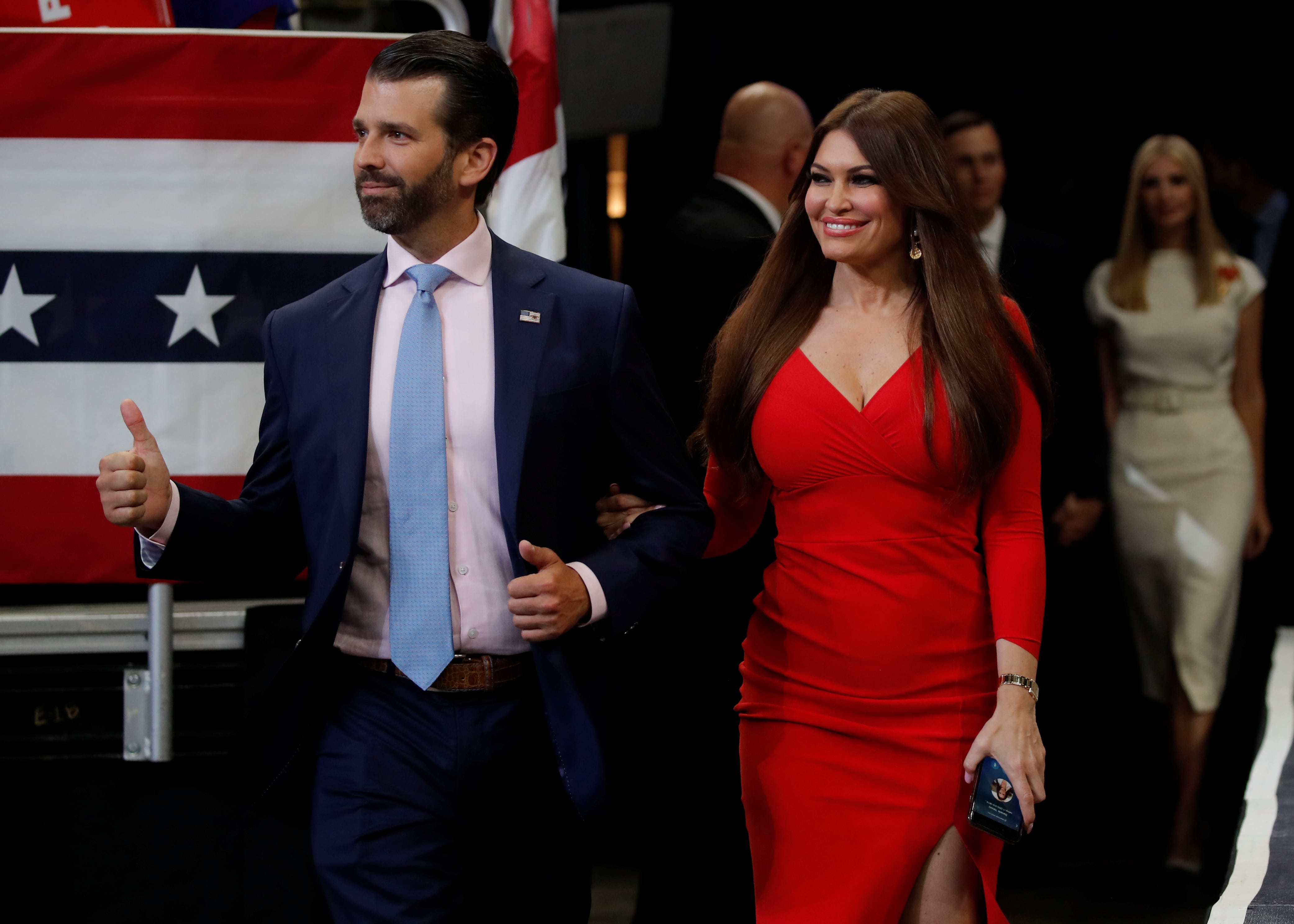 Donald Trump Jr., eldest son of U.S. President Donald Trump reacts with Kimberly Guilfoyle as the President formally kicks off his re-election bid with a campaign rally in Orlando, Florida on June 18, 2019.