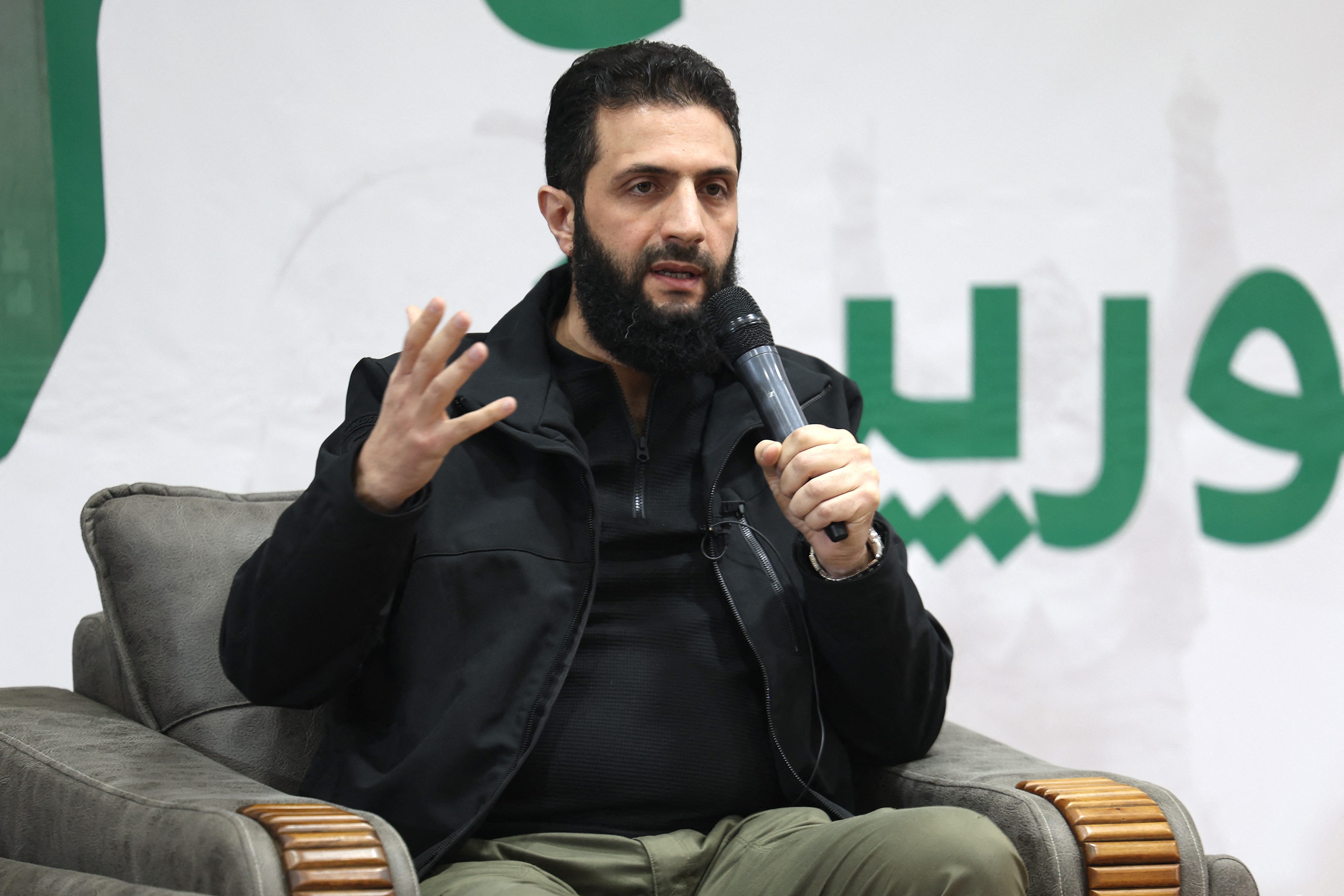 Abu Mohamed al-Jolani, head of Hayat Tahrir al-Sham (HTS), a jihadist group led by Al-Qaeda's former Syria branch, speaks during a press conference in the area of Bab al Hawa crossing northern Syria late on March 12, 2024. (Photo by Omar HAJ KADOUR / AFP) (Photo by OMAR HAJ KADOUR/AFP via Getty Images)