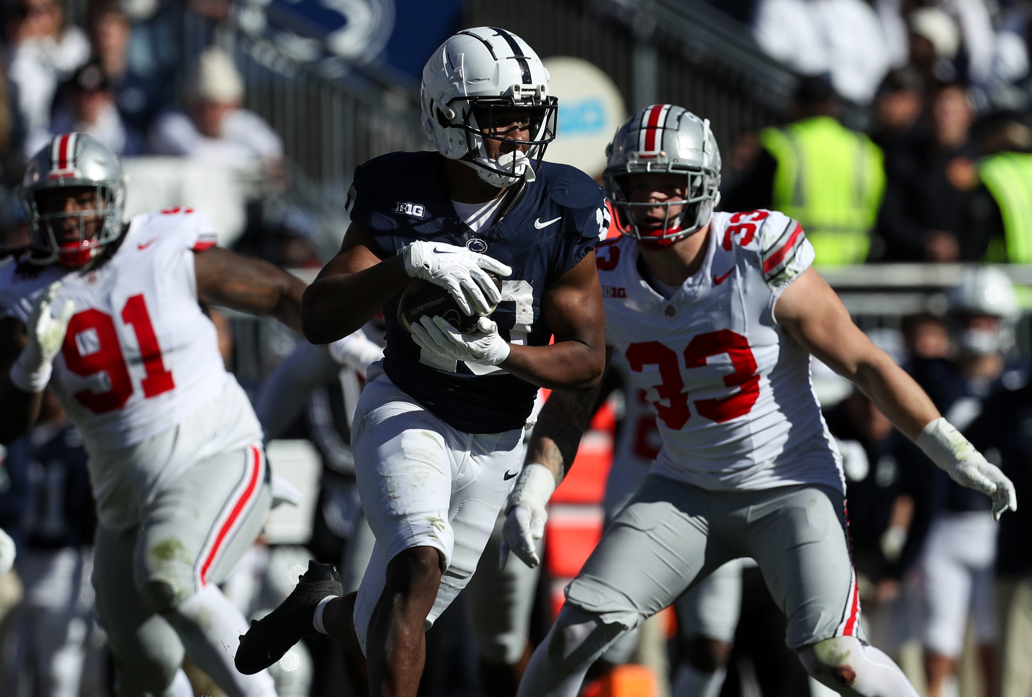 Penn State running back Nicholas Singleton (10) runs with the ball during the second quarter against Ohio State at Beaver Stadium.