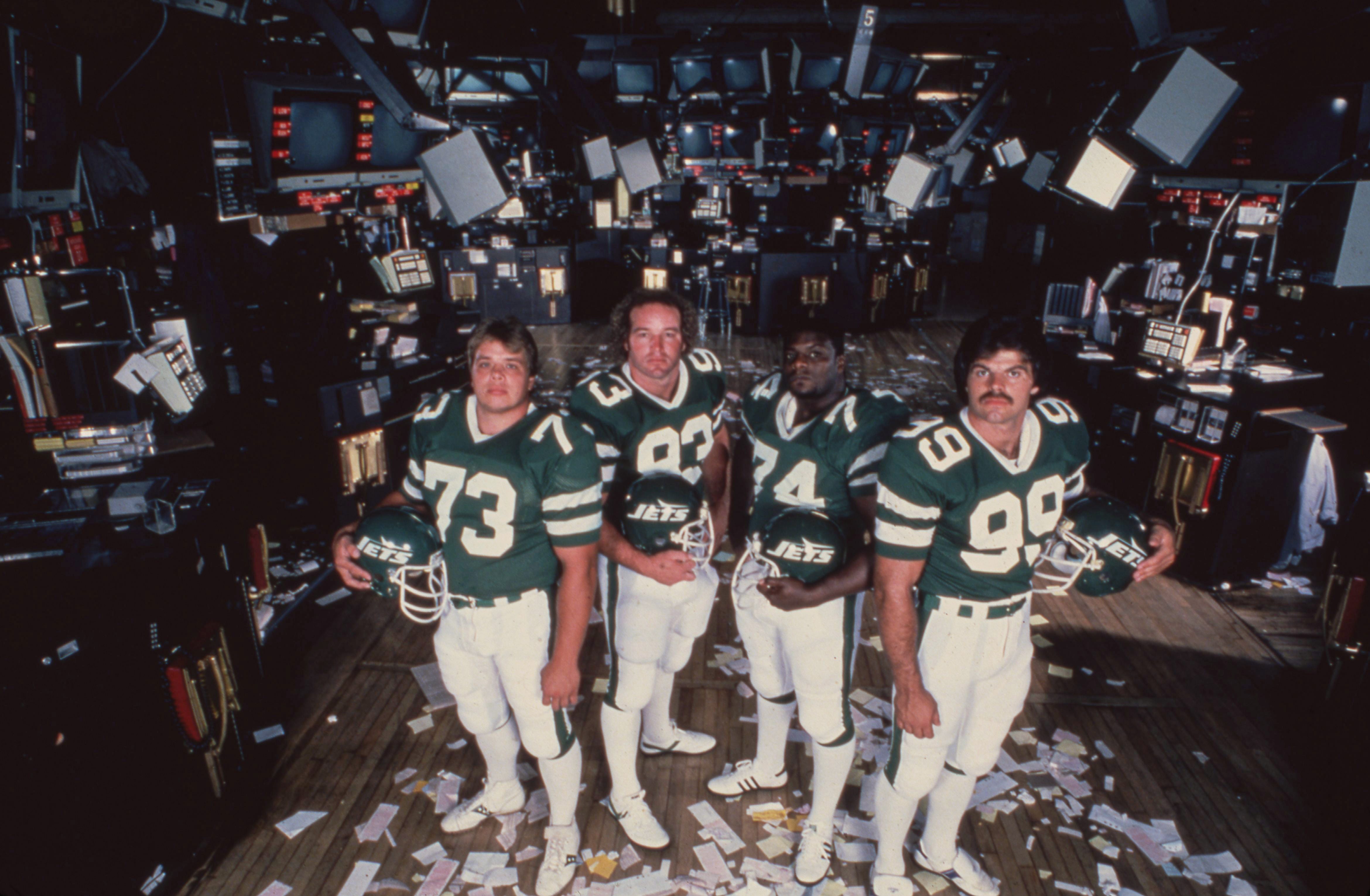 Football: New York Jets Joe Klecko (73), Marty Lyons (93), Abdul Salaam (74) and Mark Gastineau (99) pose for a photo on the floor of the New York Stock Exchange.   CREDIT: Ronald C. Modra (Photo by Ronald C. Modra/Sports Illustrated via Getty Images)   (Set Number: X27097 TK1)