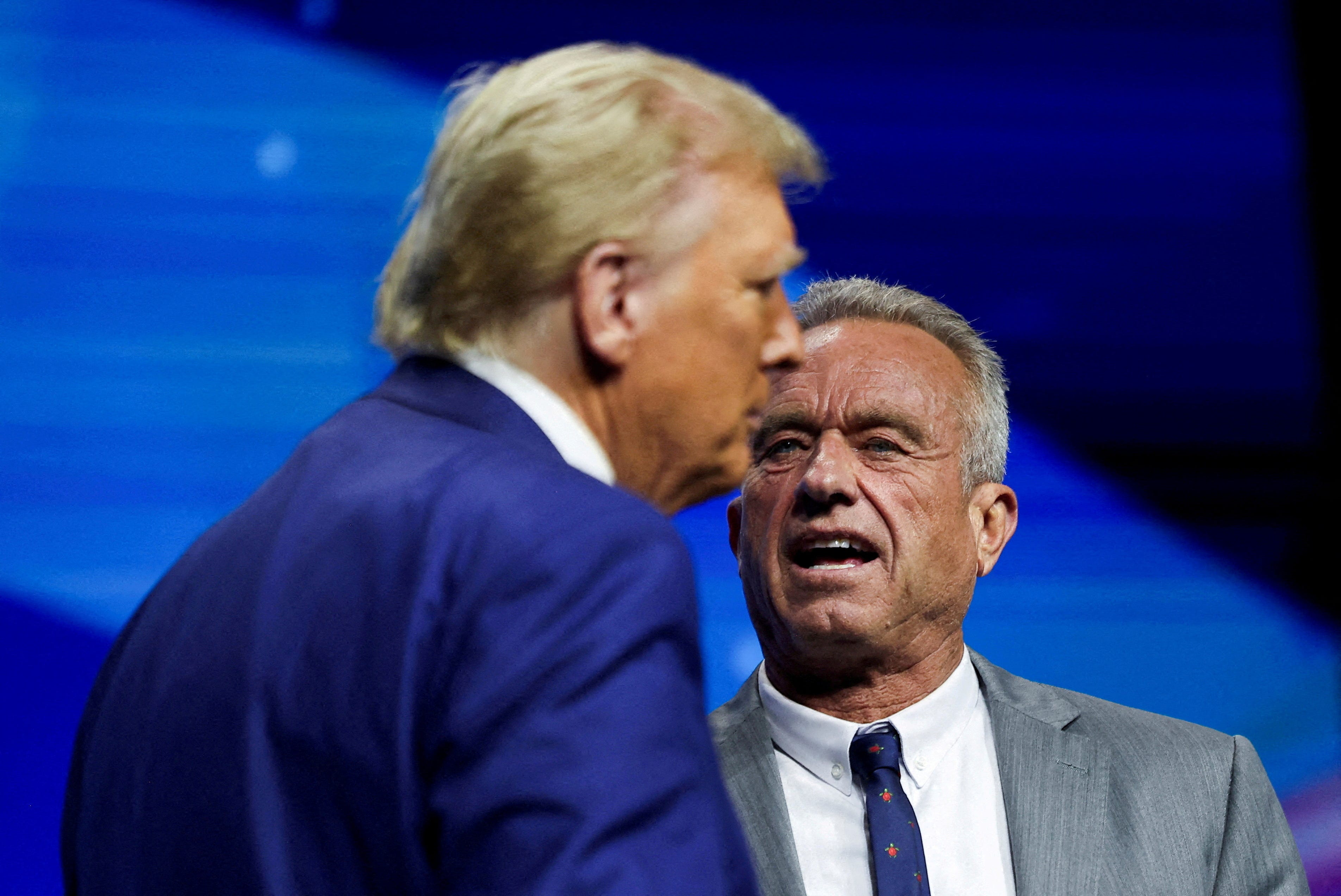 Robert F. Kennedy Jr. and Republican presidential nominee and former U.S. President Donald Trump attend a campaign event sponsored by conservative group Turning Point USA, in Duluth, Georgia, U.S., October 23, 2024.