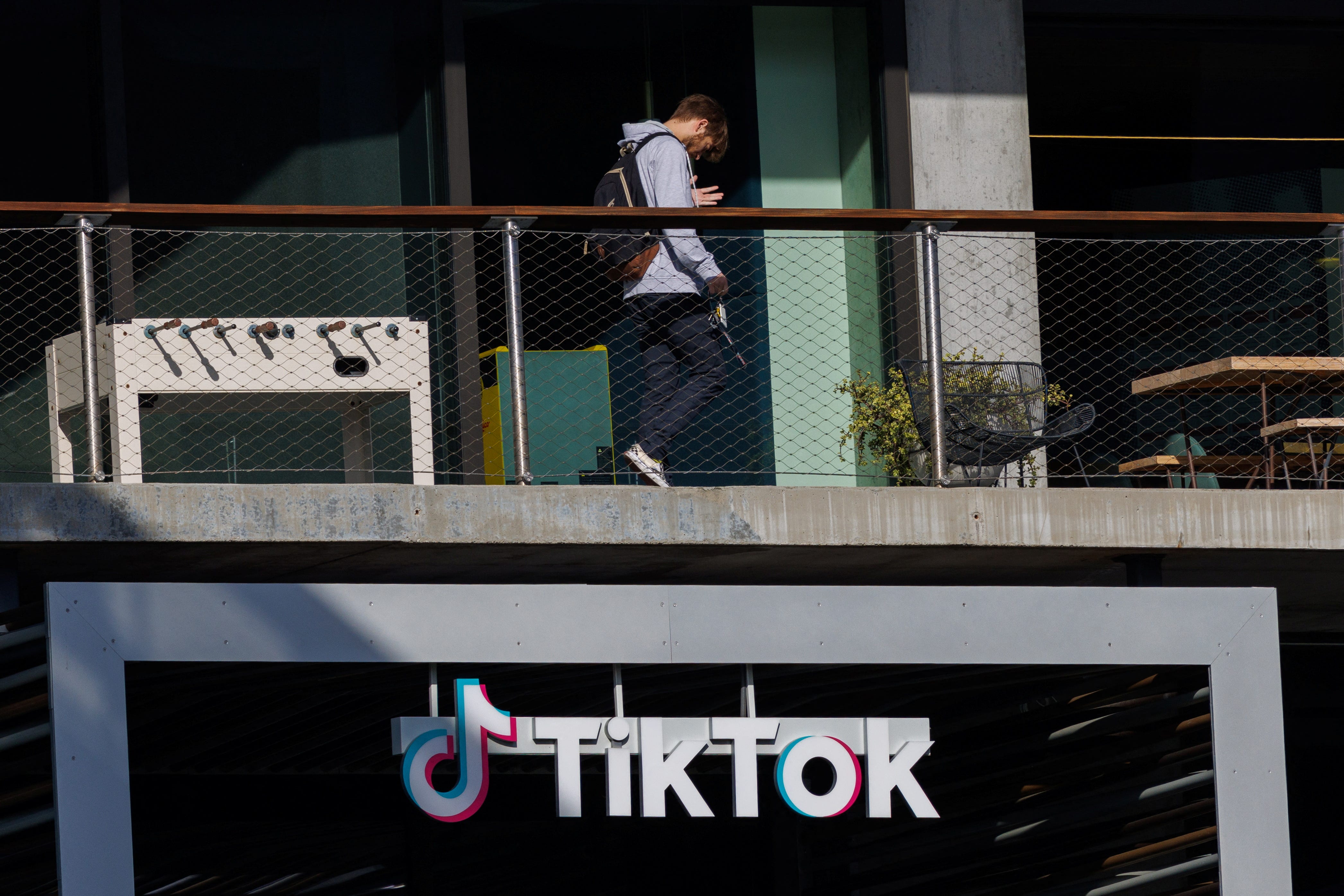 A person arrives at the offices of Tik Tok after the U.S. House of Representatives overwhelmingly passed a bill that would give TikTok's Chinese owner ByteDance about six months to divest the U.S. assets of the short-video app or face a ban, in Culver City, California, U.S., March 13, 2024.