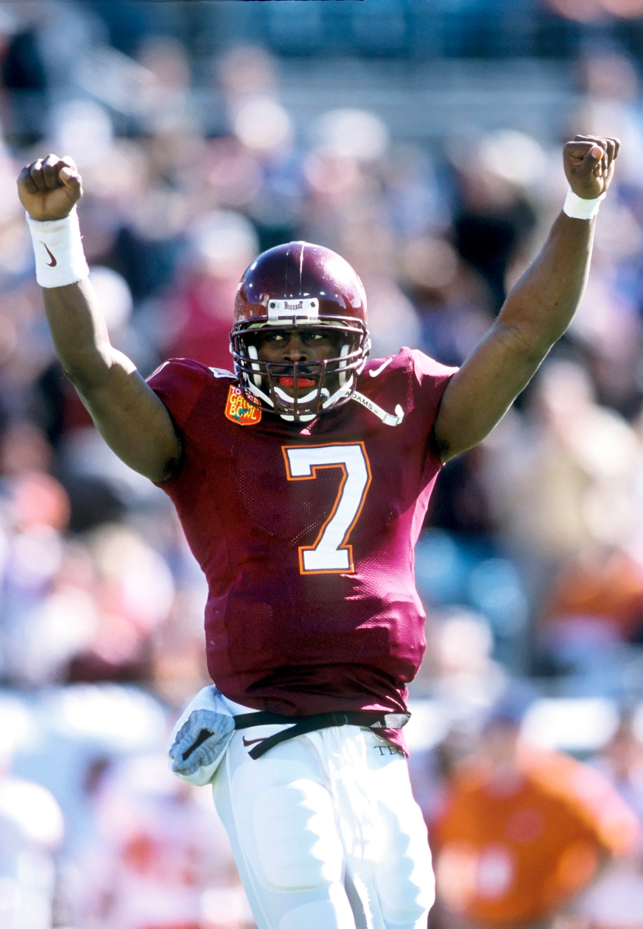 Virginia Tech quarterback Michael Vick celebrates a play against Clemson during the 2001 Gator Bowl.