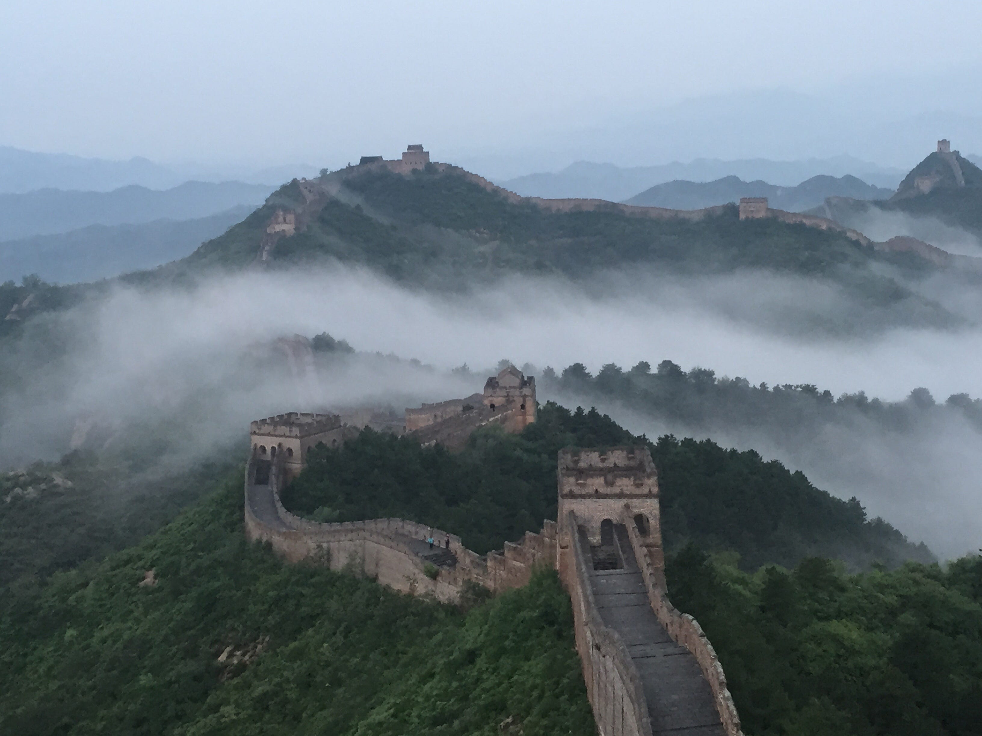 Low clouds enrobe the Jinshanling section of the Great Wall in Chengde, Hebei Province of China on Aug. 20, 2015.