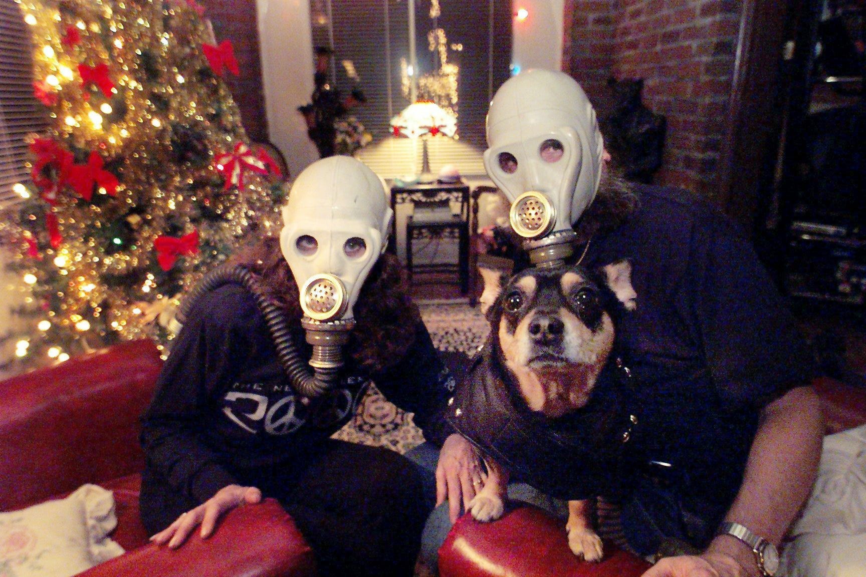 Ready for any Y2K scenarios, Sam and Ria Skemp and the pet Chihuahua, Rattel, are ready to celebrates the New Year on Dec. 31, 1999, at home with party and all of the things they bought for Y2K, including gas masks.