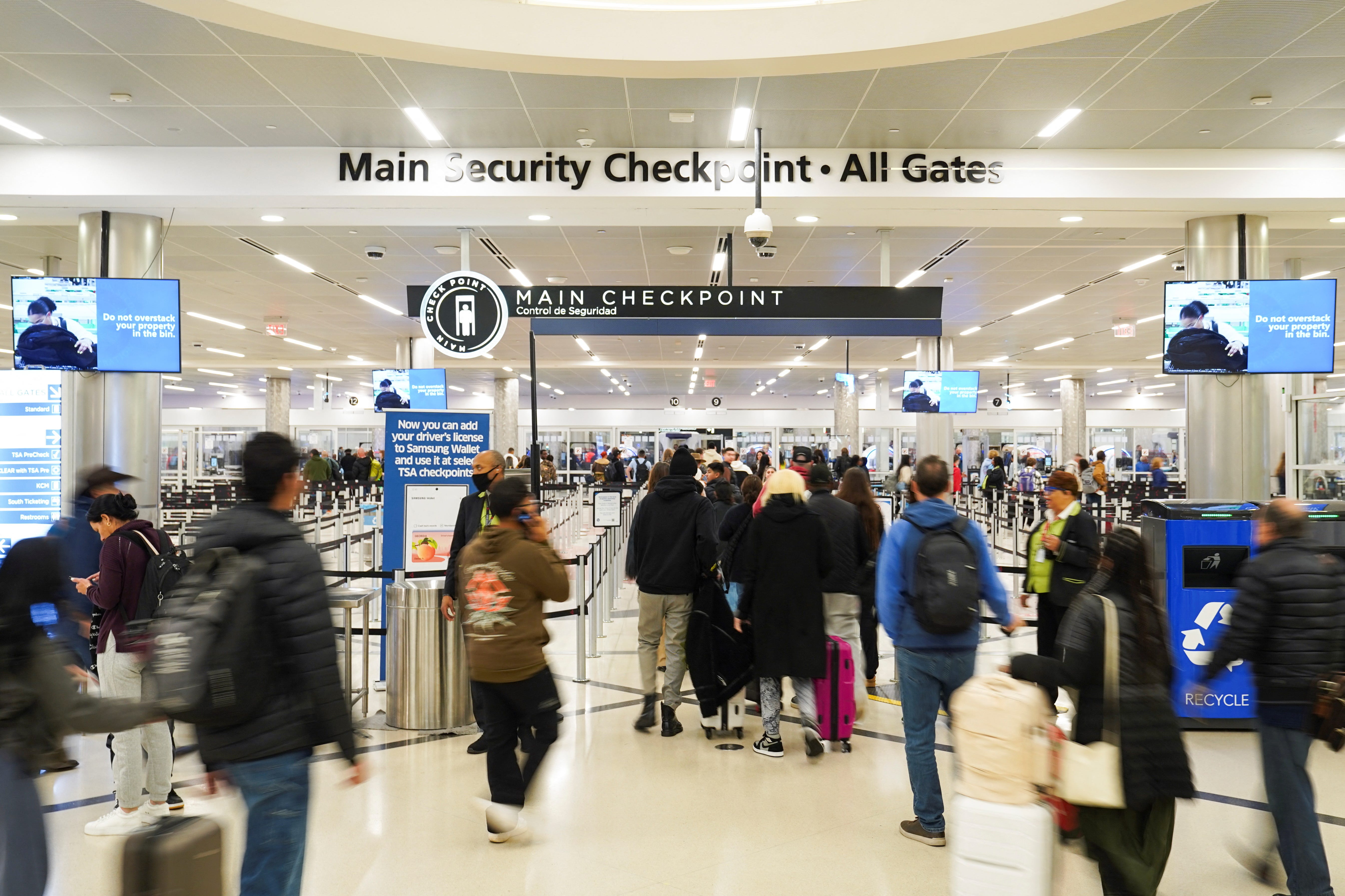 People walk up to security check-in at the airport at Hartsfield-Jackson Atlanta International Airport on November 27, 2024.