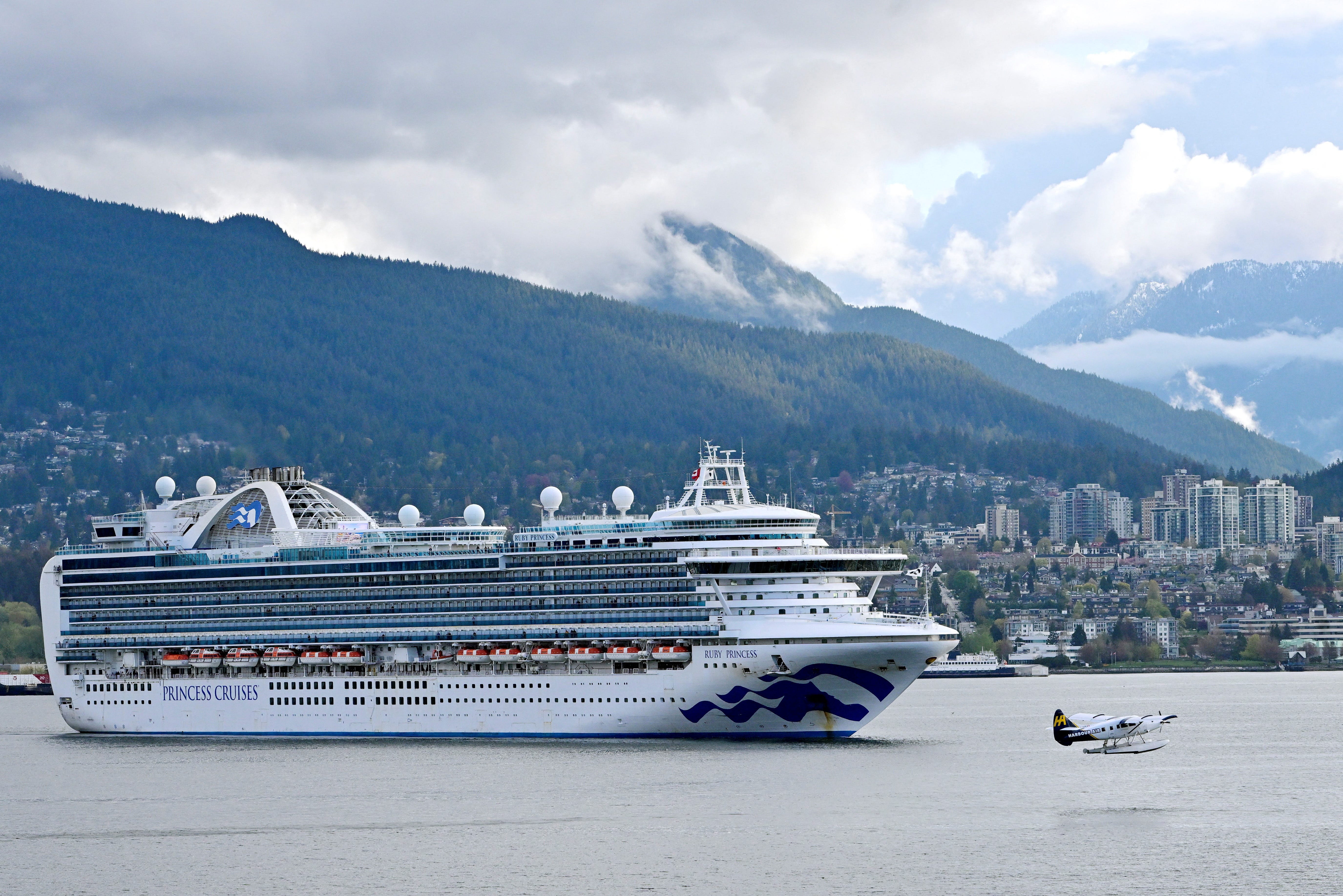 A float plane passes in front of the Ruby Princess in Vancouver, Canada on April 27, 2022.