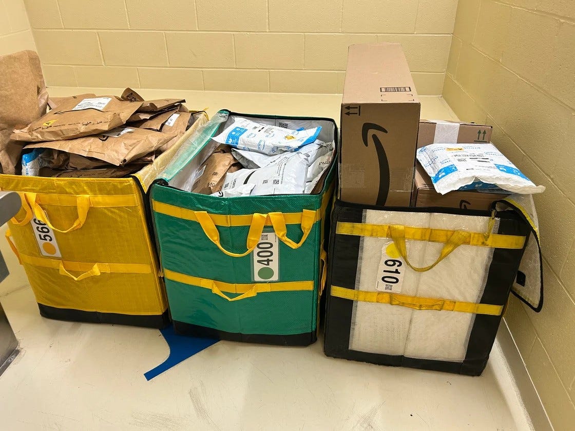 Three totes full of undelivered packages from Amazon.com were discovered in the woods in Middleboro early Sunday morning Dec. 22, 2024, according to Lakeville police.