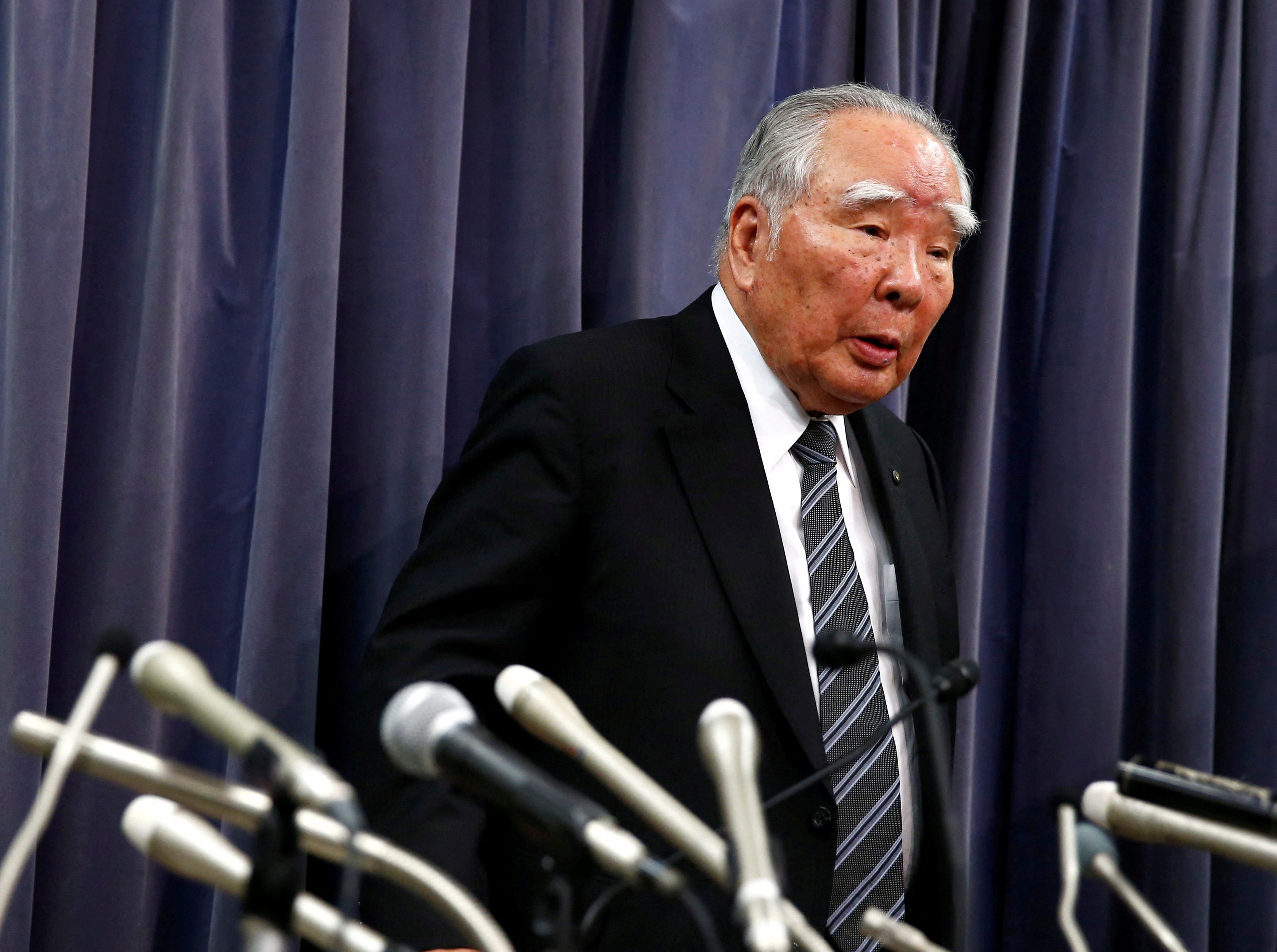 Suzuki Motor former Chief Executive Officer Osamu Suzuki leaves a news conference at the Land, Infrastructure, Transport and Tourism Ministry in Tokyo, Japan on May 18, 2016.