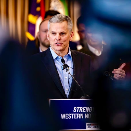 Gov. Josh Stein speaks during a media briefing in Downtown Asheville on January 2, 2025. Stein signed five executive orders Jan. 2 to support the Helene recovery effort.