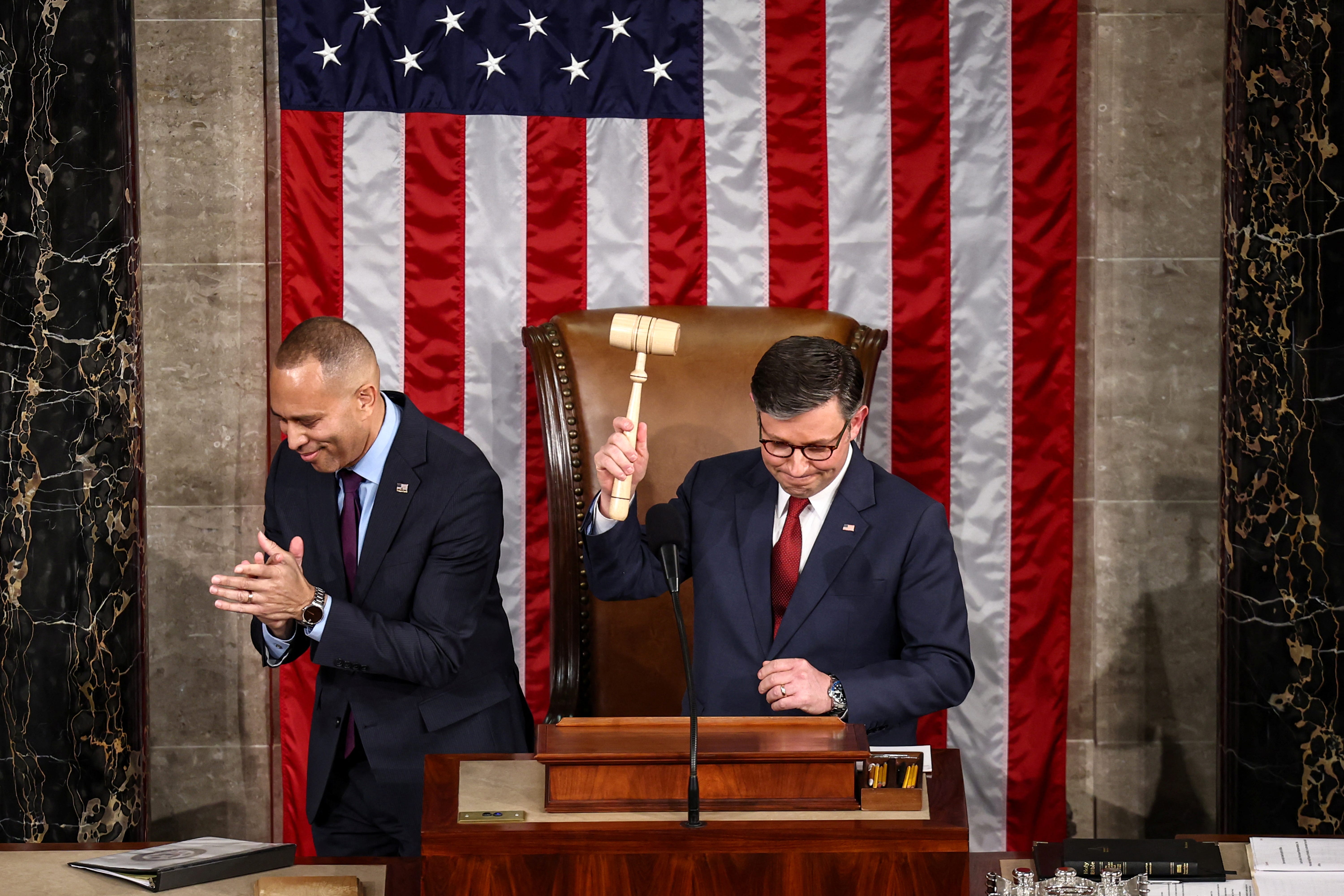 House Speaker Mike Johnson, R-La., receives the gavel on Jan. 3, 2025, from Democratic leader Hakeem Jeffries, D-N.Y., as he's sworn in for another term leading the House of Representatives.