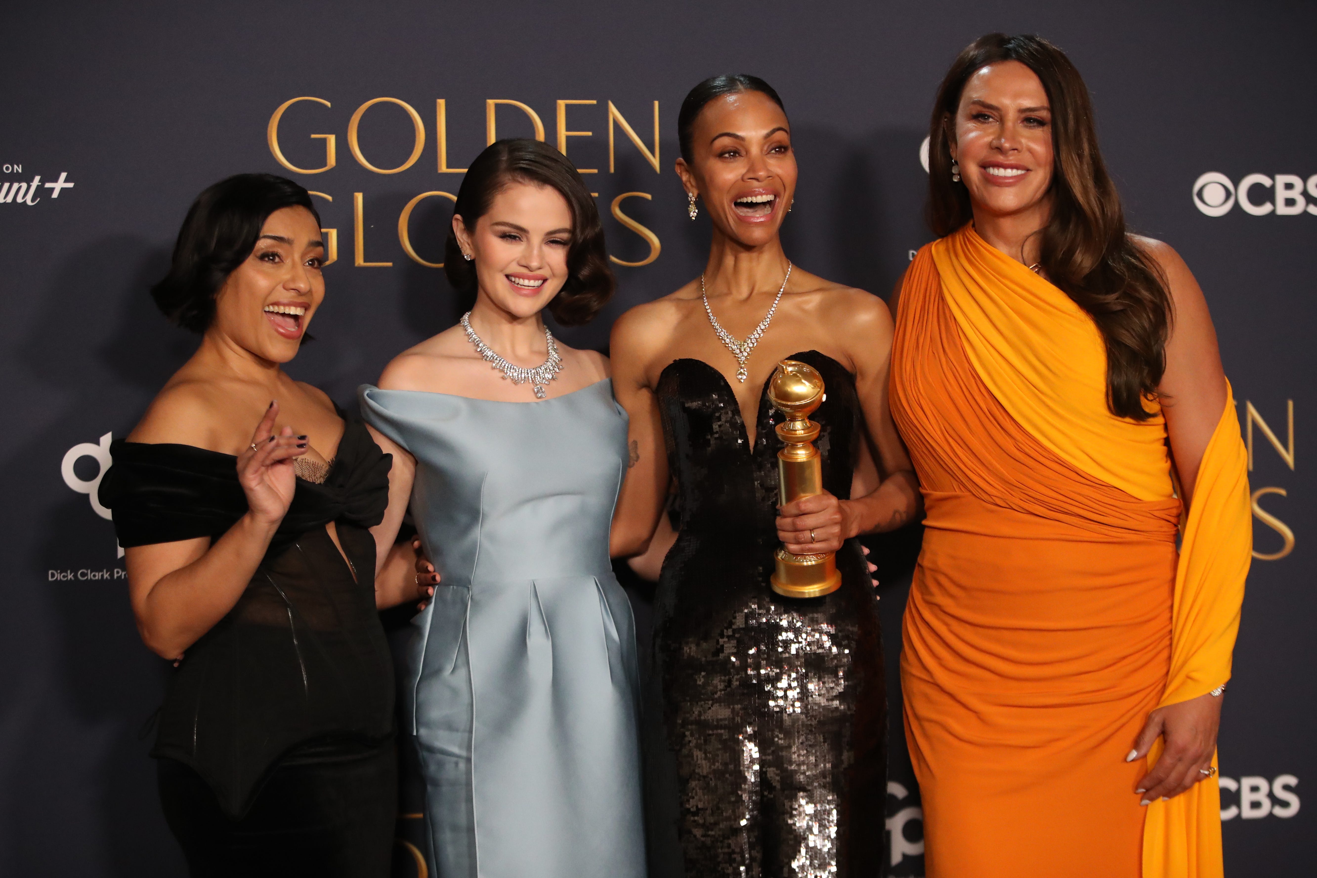 Adriana Paz, left, Selena Gomez, Zoe Saldana and Karla Sofía Gascón backstage at the Golden Globe Awards on Sunday.