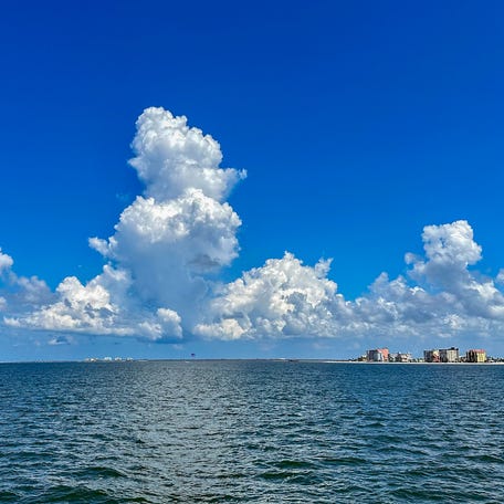 Afternoon clouds build over the Gulf of Mexico in this 2023 photo taken from near Fort Myers Beach, Florida.