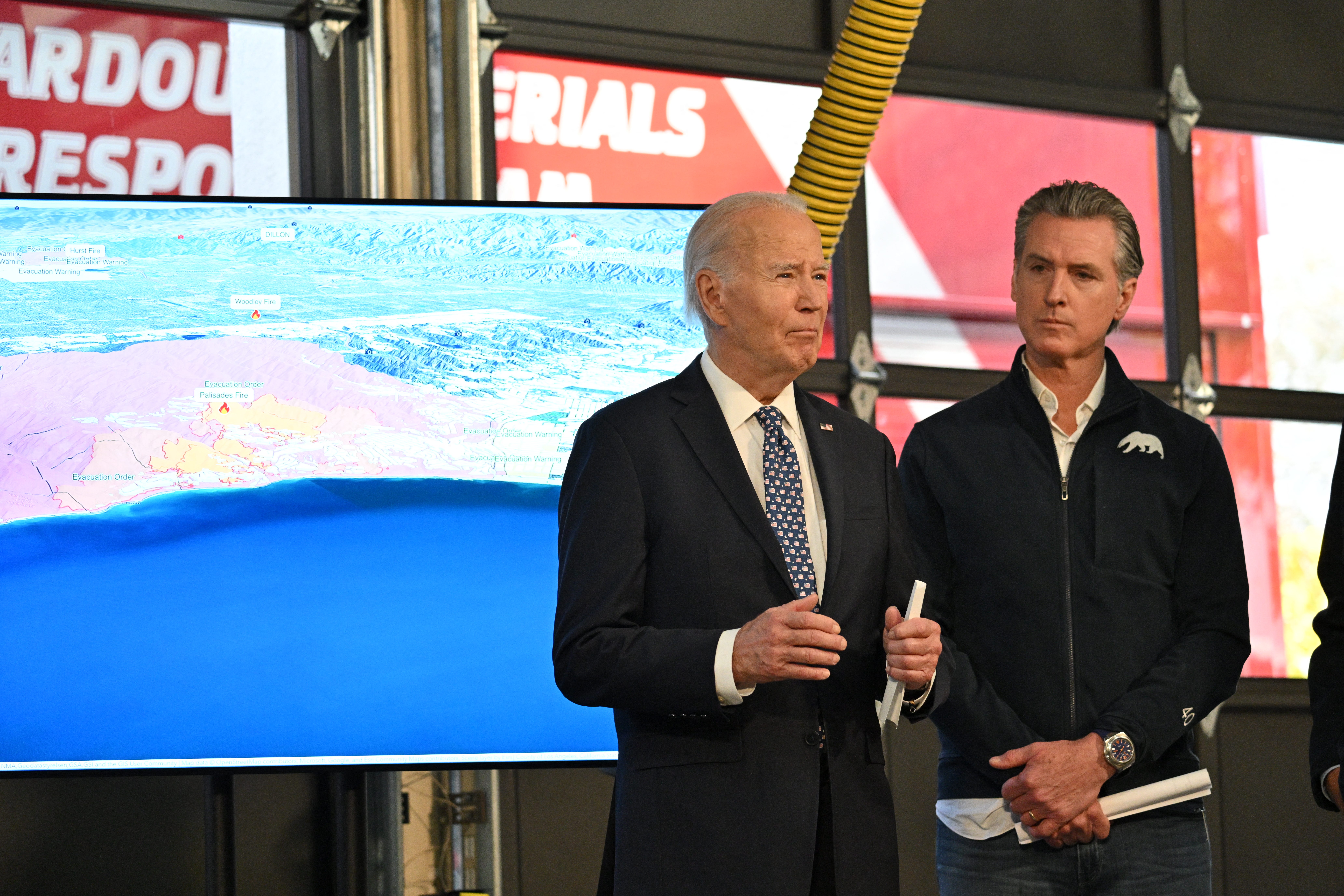 President Joe Biden and California Gov. Gavin Newsom speak in Santa Monica during a briefing from CalFire officials on the Palisades wildfire on Jan. 8, 2025.