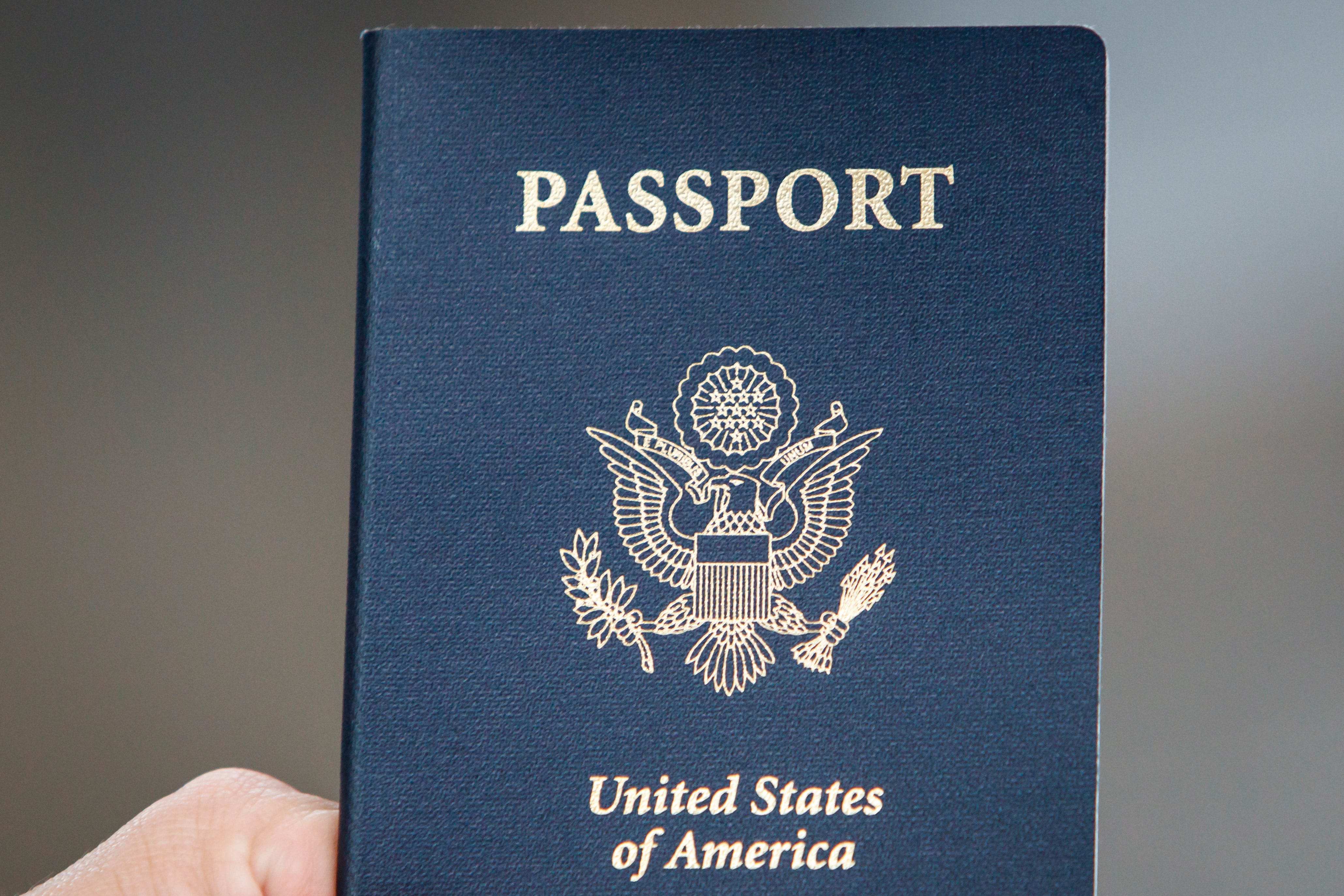 A passport is passed to its owner at the Federal Inspection Services customs facility at Bush Intercontinental Airport in Terminals E, on May 23, 2012, in Houston, Texas.
