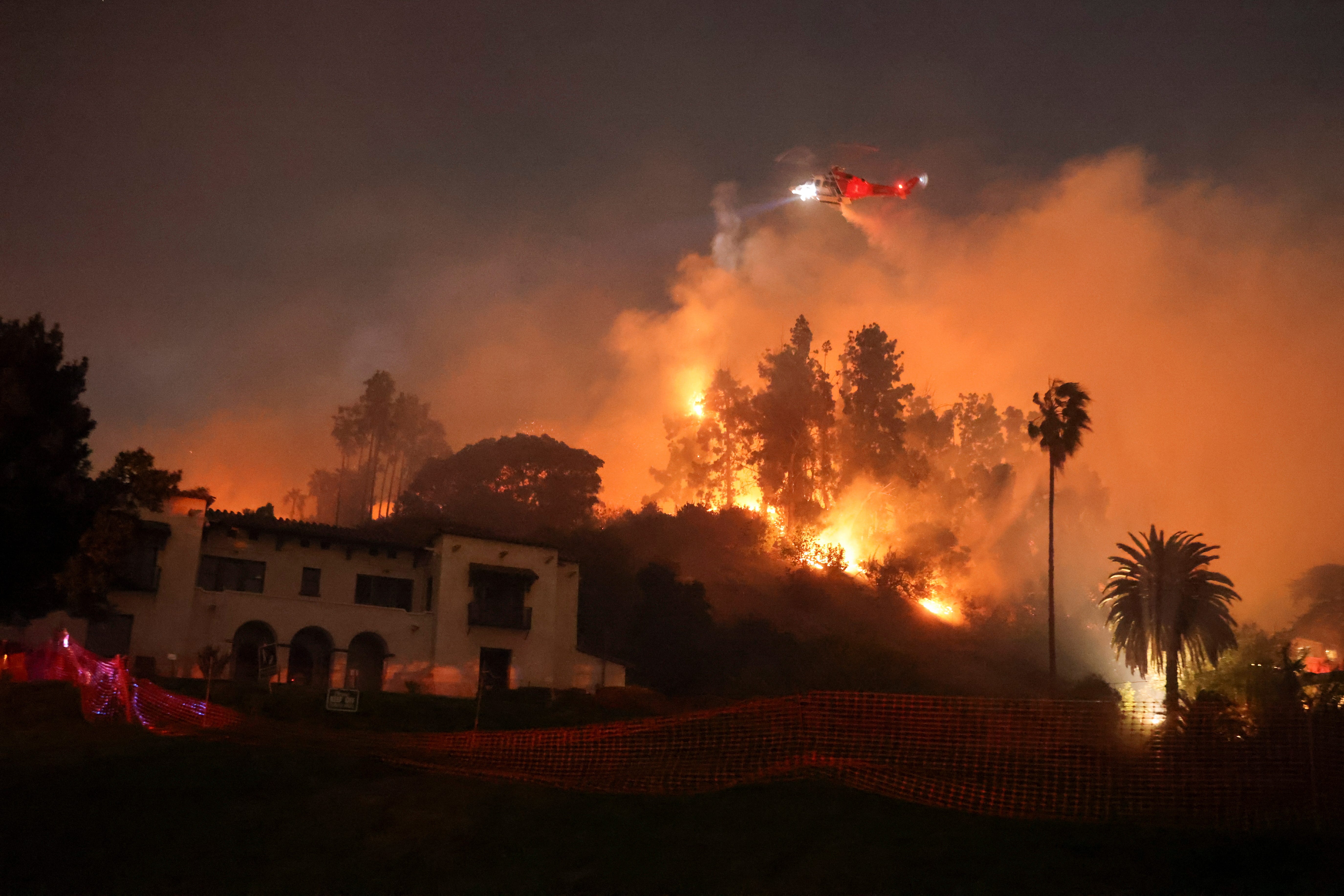 Flames rise from the Sunset Fire in the hills overlooking the Hollywood neighborhood of Los Angeles, California, U.S. January 8, 2025.