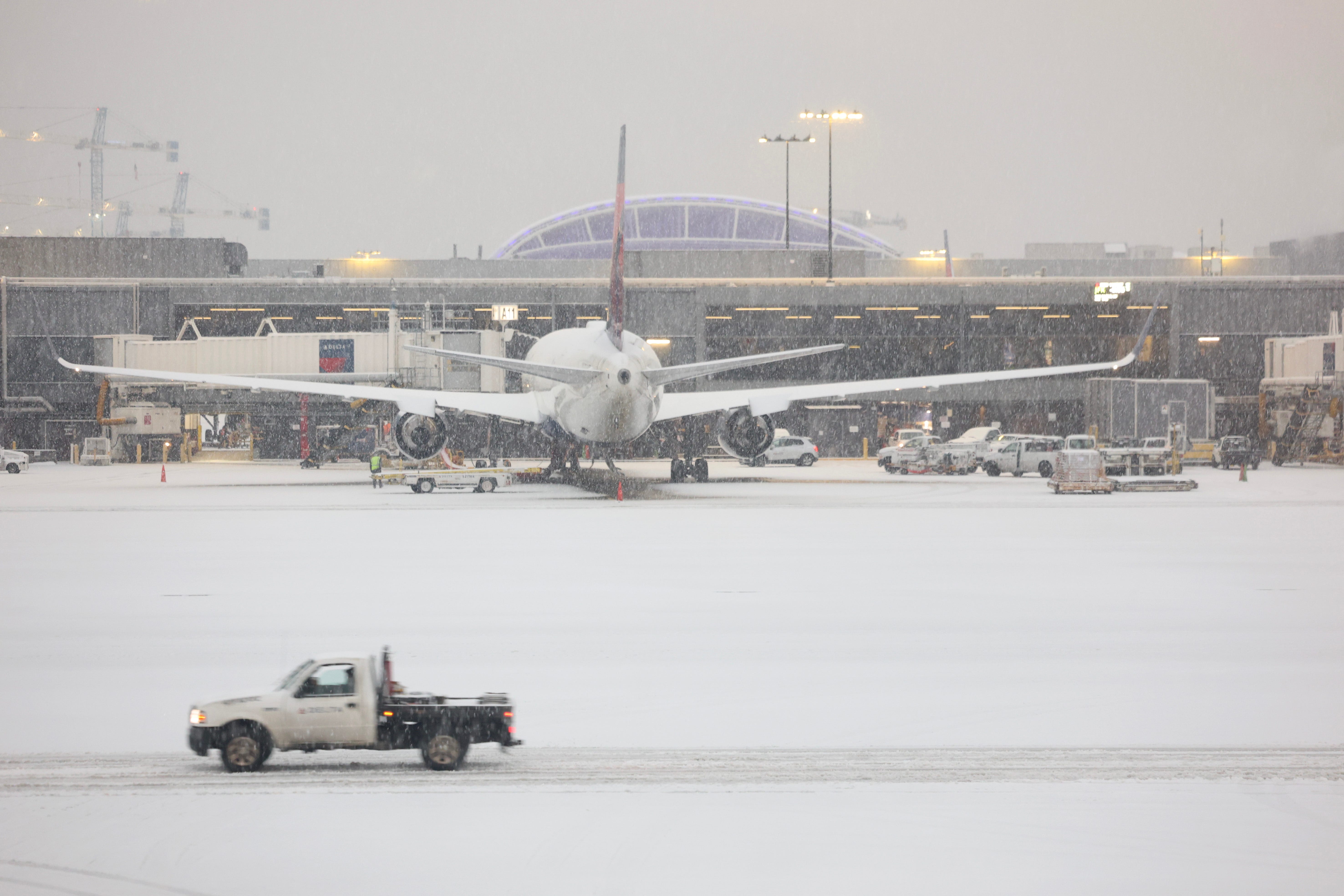 Snow blankets Hartsfield-Jackson Atlanta International Airport as a winter storm moves into the area on Jan. 10, 2025.
