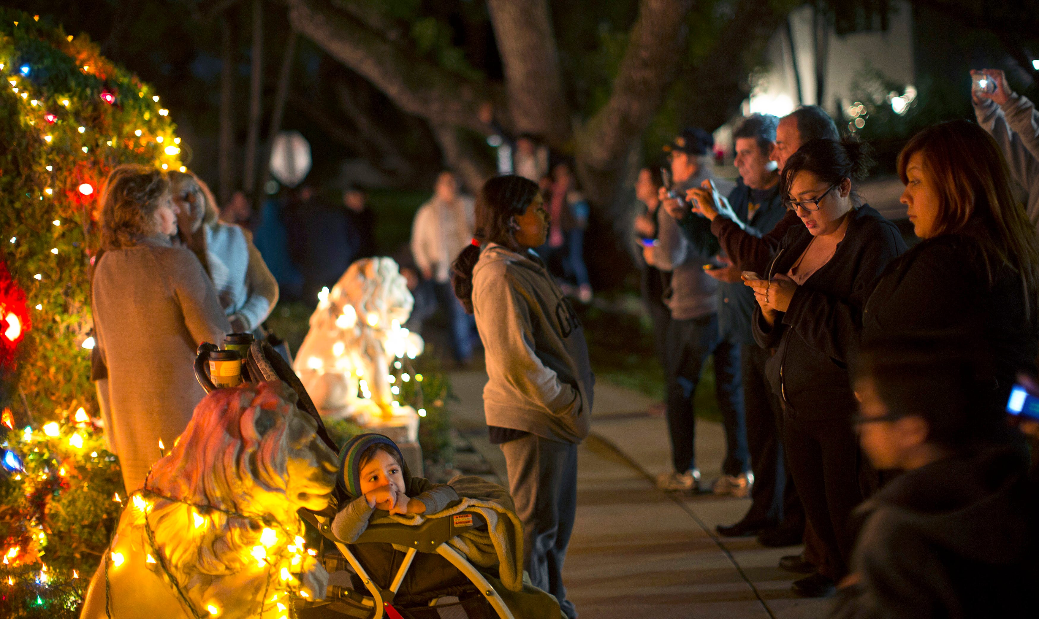 People stop by the Balian Ice Cream House which is decorated for Christmas in Altadena, Calif., Dec. 17, 2014.