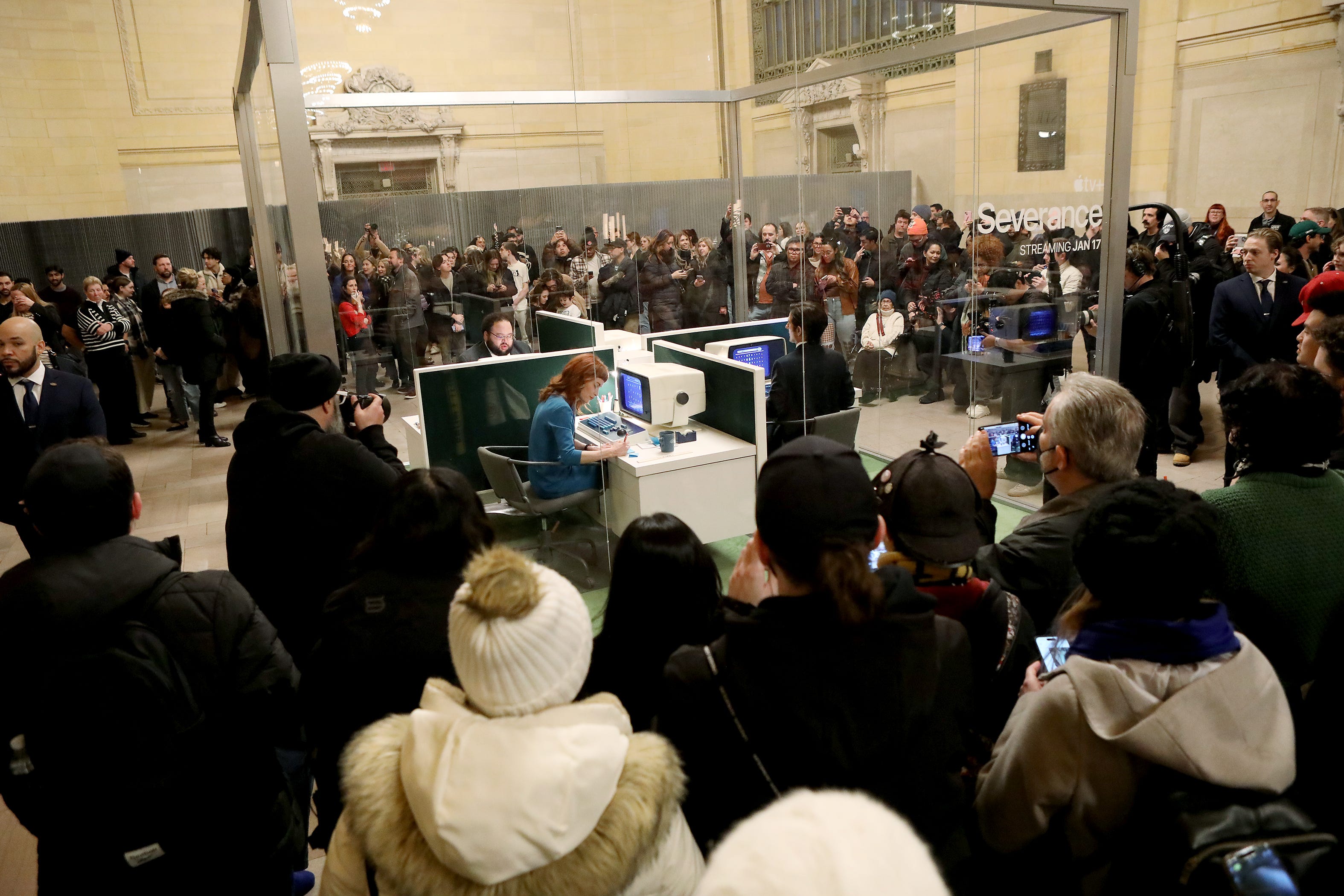 Adam Scott, Zach Cherry and Britt Lower appear at a pop-up for the second season of "Severance" in Grand Central Station on Jan. 14, 2025.