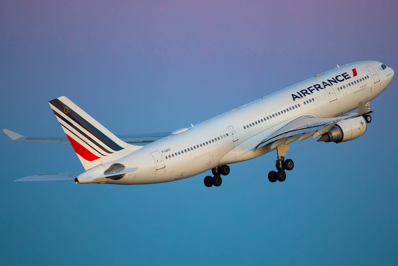 Air France takes off from Seattle to Paris as a gorgeous color gradient fills the sky in March, 2019.