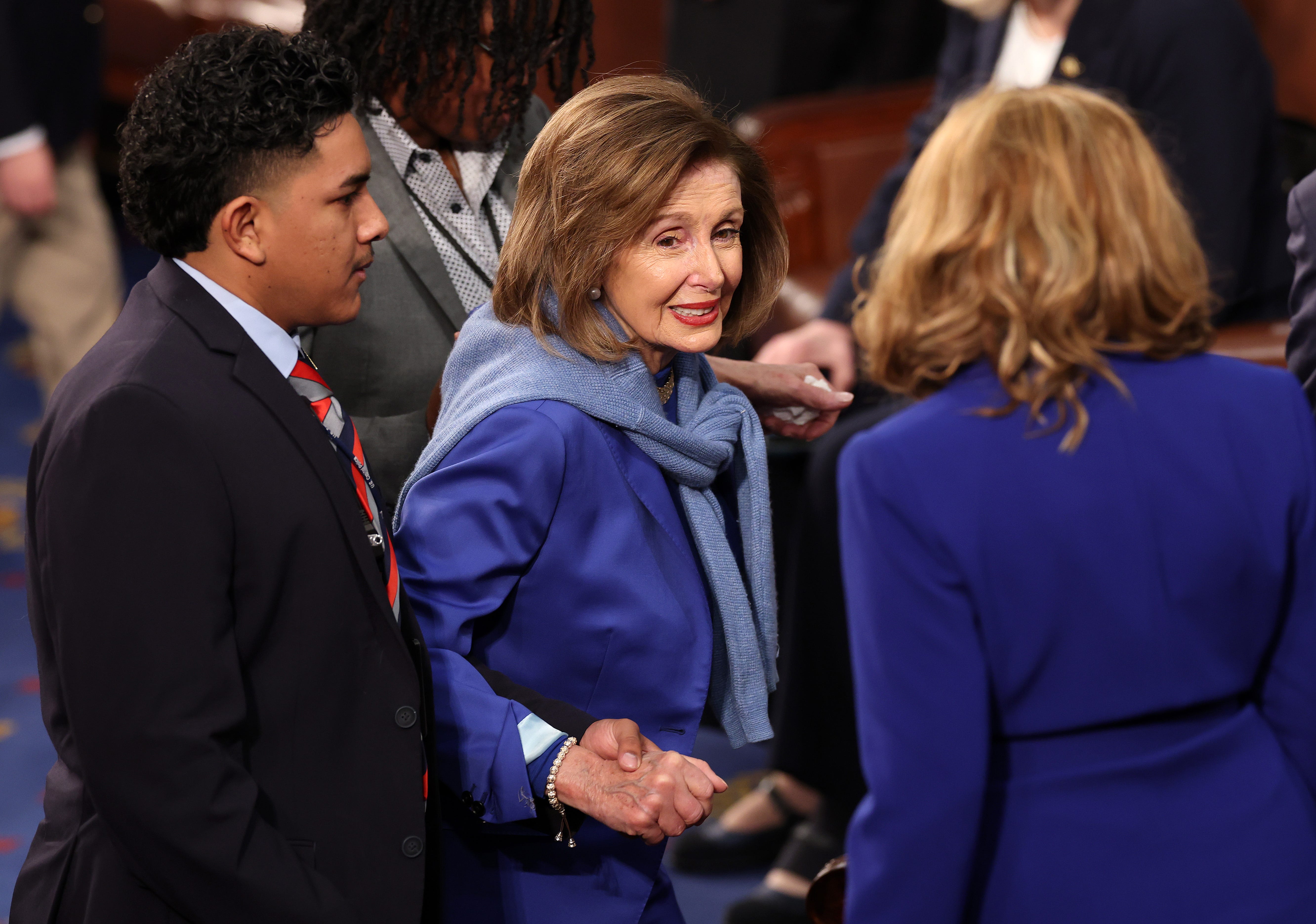 Former Speaker of the House, U.S. Rep. Nancy Pelosi (D-CA) is assisted by aides as she arrives for the first day of the 119th Congress in the House Chamber of the U.S. Capitol Building on January 03, 2025 in Washington, DC.