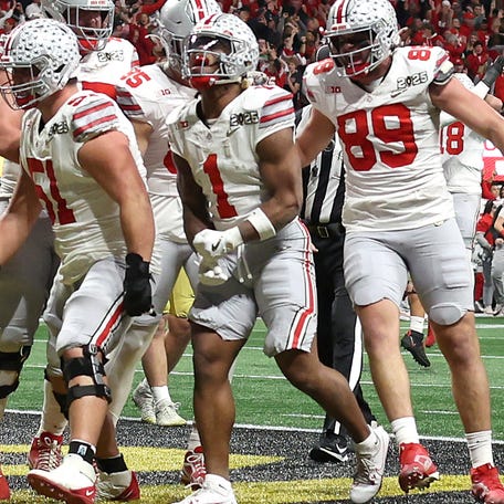 Ohio State running back Quinshon Judkins celebrates with teammates after a scoring a touchdown against Notre Dame during the second quarter in the College Football Playoff championship game at the Mercedes-Benz Stadium.