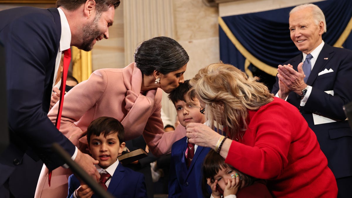Departing President Joe Biden, right, applauds as Vice President-elect JD Vance celebrates with with his family during inauguration ceremonies at the U.S. Capitol on Jan. 20, 2025, in Washington, DC.