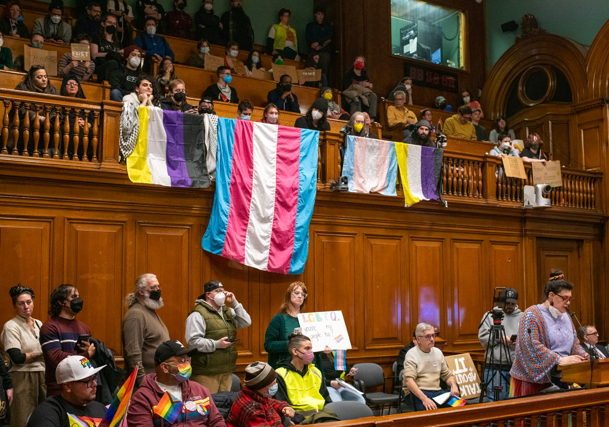 A line of people wait to speak while others fill the balcony during a public comment portion of the Worcester City Council meeting Tuesday.