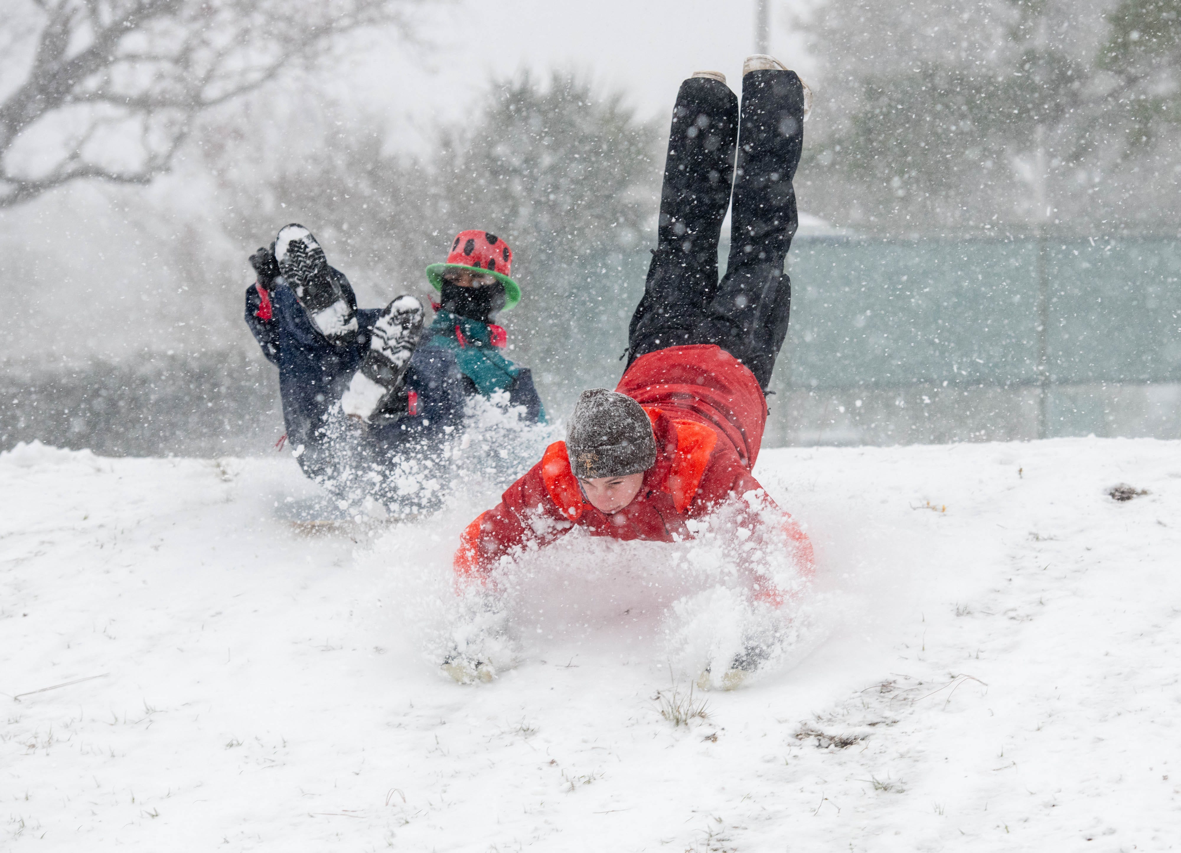 People enjoy the snow storm at Bayview Park in Pensacola, Fla. on Tuesday, Jan. 21, 2025.