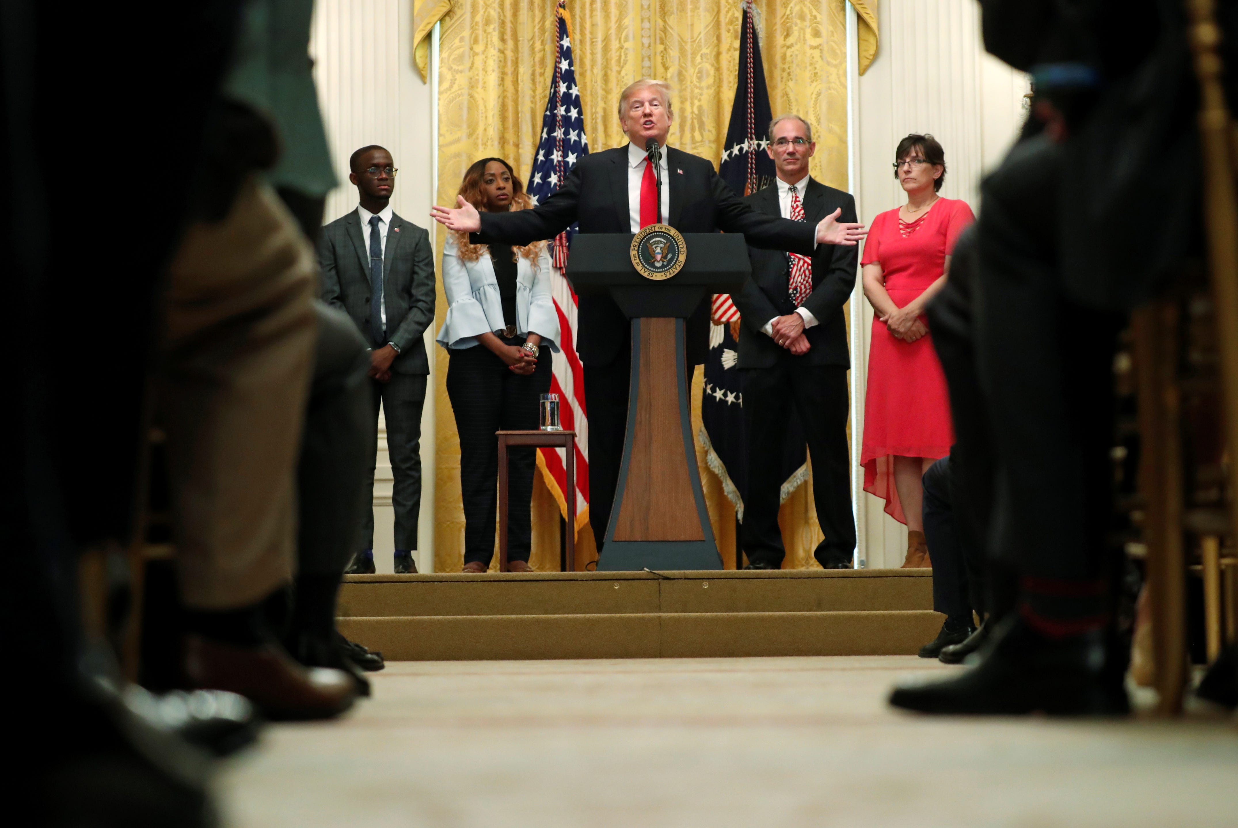 U.S. President Donald Trump holds a news conference to mark six months since the passage of the Tax Cuts and Jobs Act, in the White House East Room in Washington, U.S., June 29, 2018.