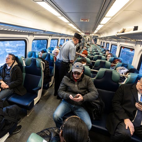 Passengers ride a Metro-North Hudson Line train into Manhattan during the morning rush hour Jan. 27, 2025.