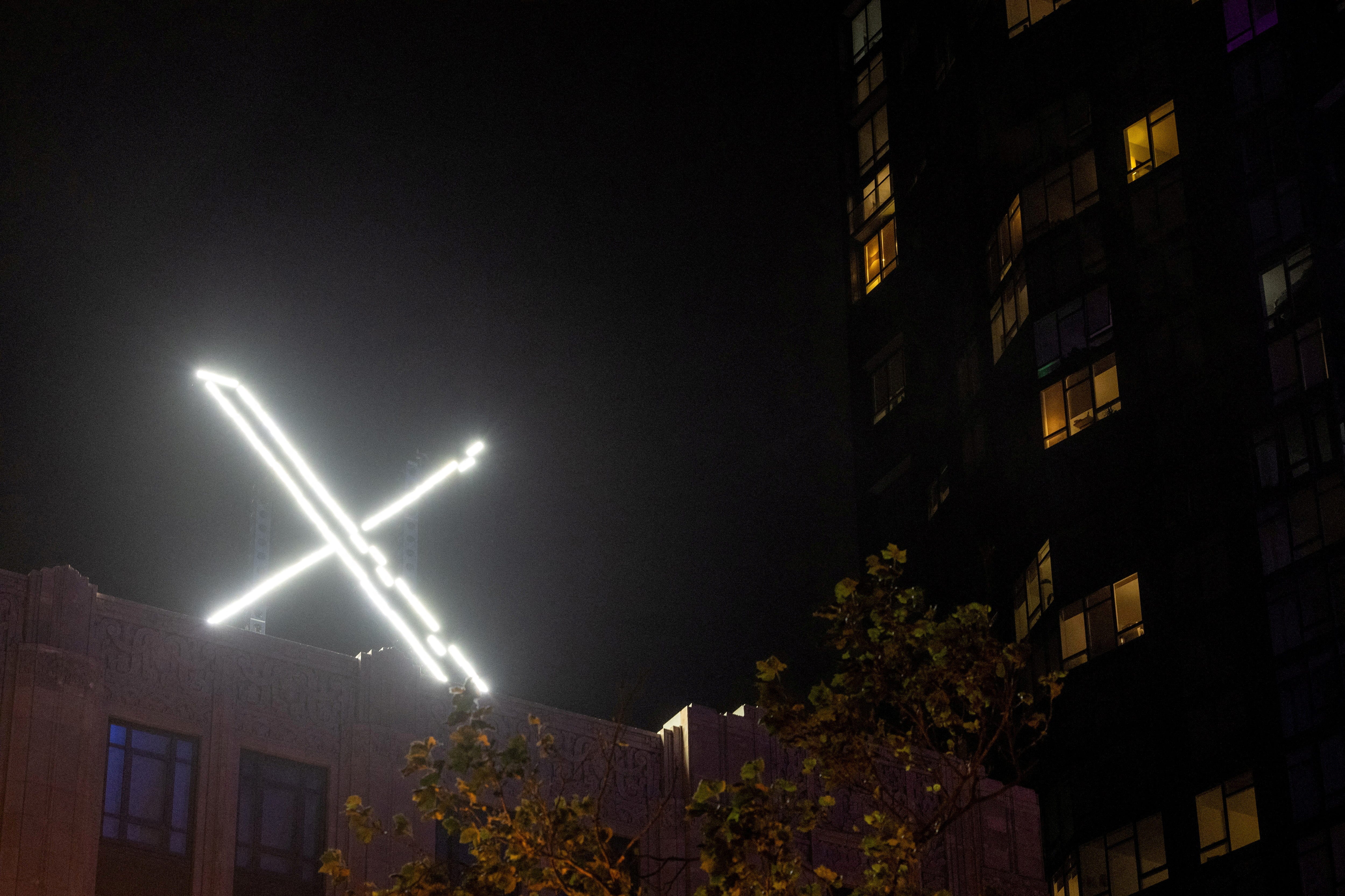 'X' logo is seen on the top of the headquarters of the social media platform X in downtown San Francisco on July 30, 2023.