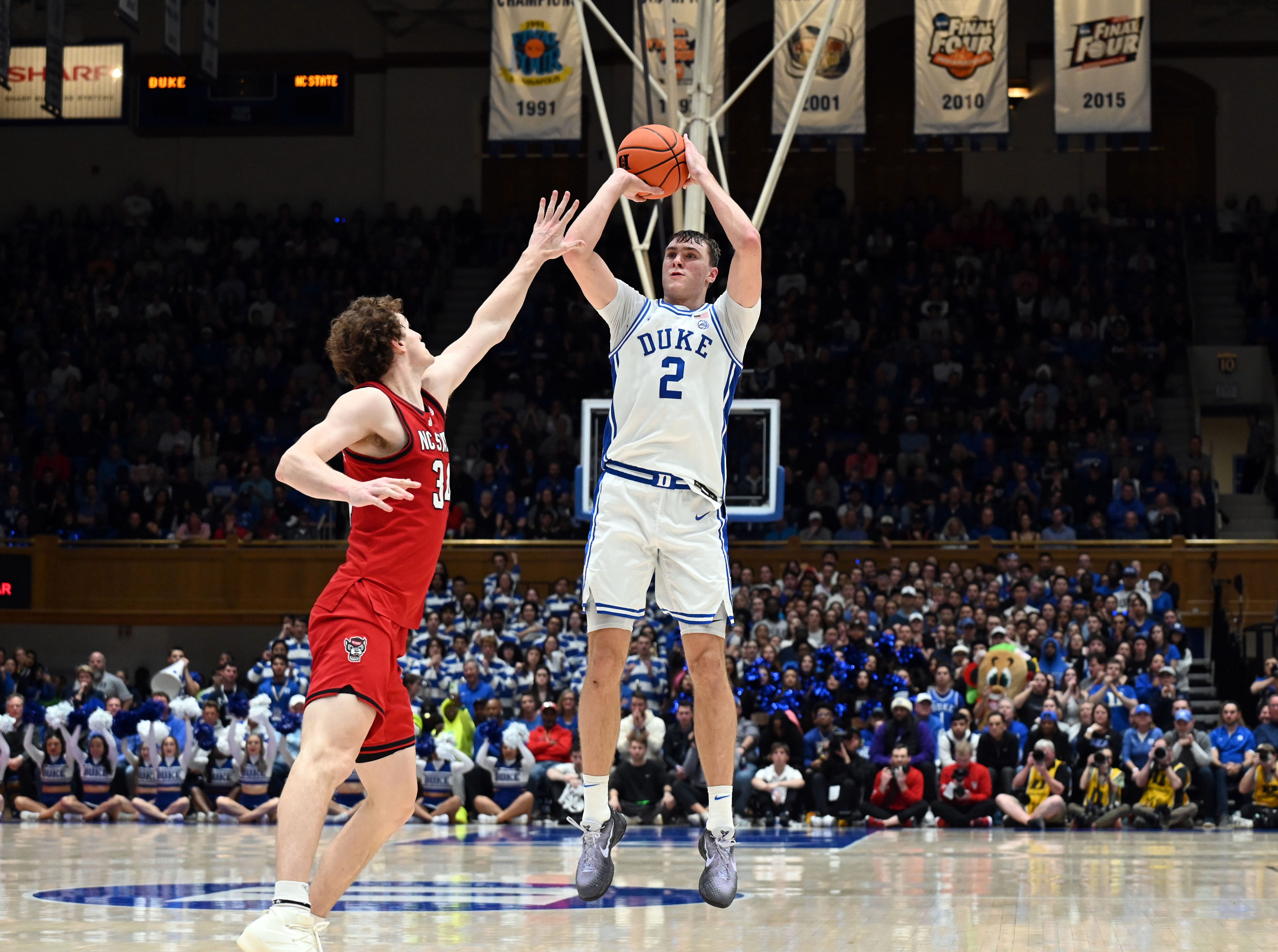 Duke forward Cooper Flagg (2) shoots over North Carolina State forward Ben Middlebrooks during their game at Cameron Indoor Stadium.