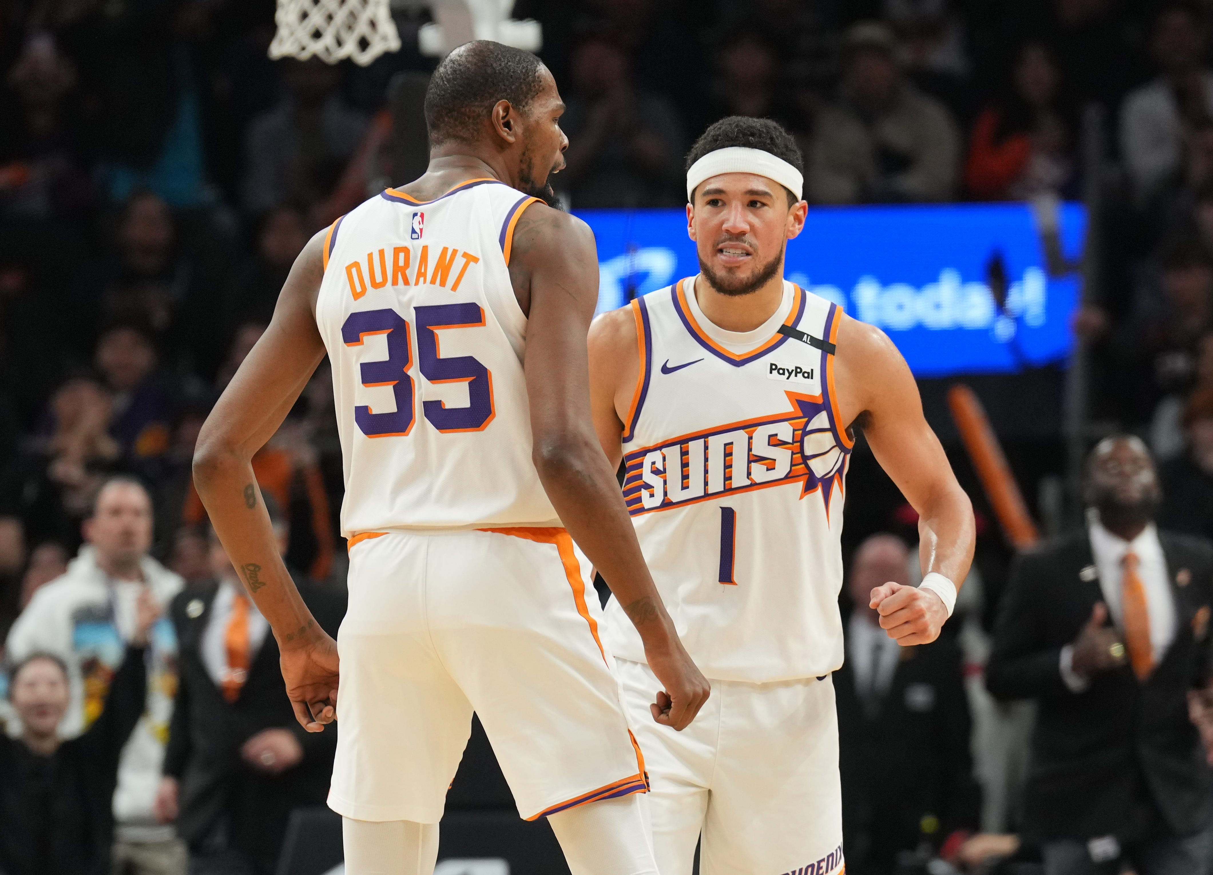Suns forward Kevin Durant (35) and guard Devin Booker (1) celebrate during the Jan. 27 game against the Clippers.