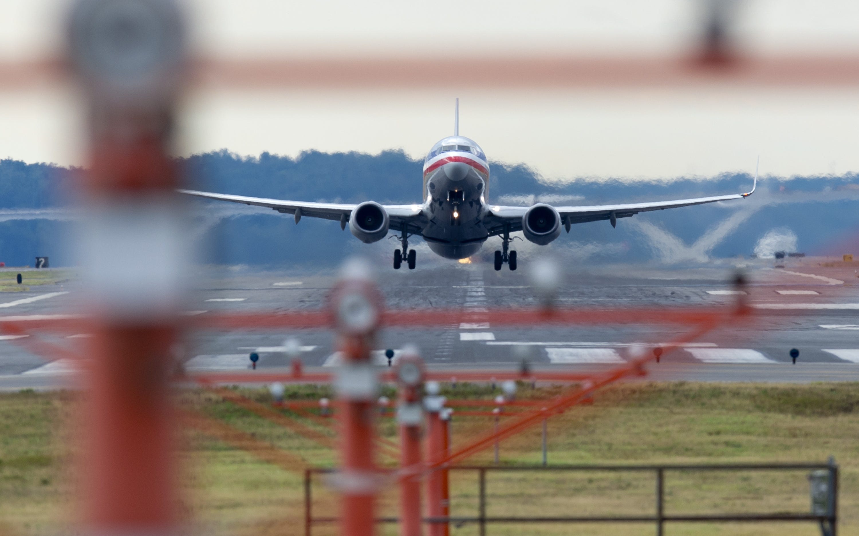 An American Airlines Boeing 737 airplane takes off from a runway at Ronald Reagan Washington National Airport in Arlington, Virginia, September 23, 2013.
