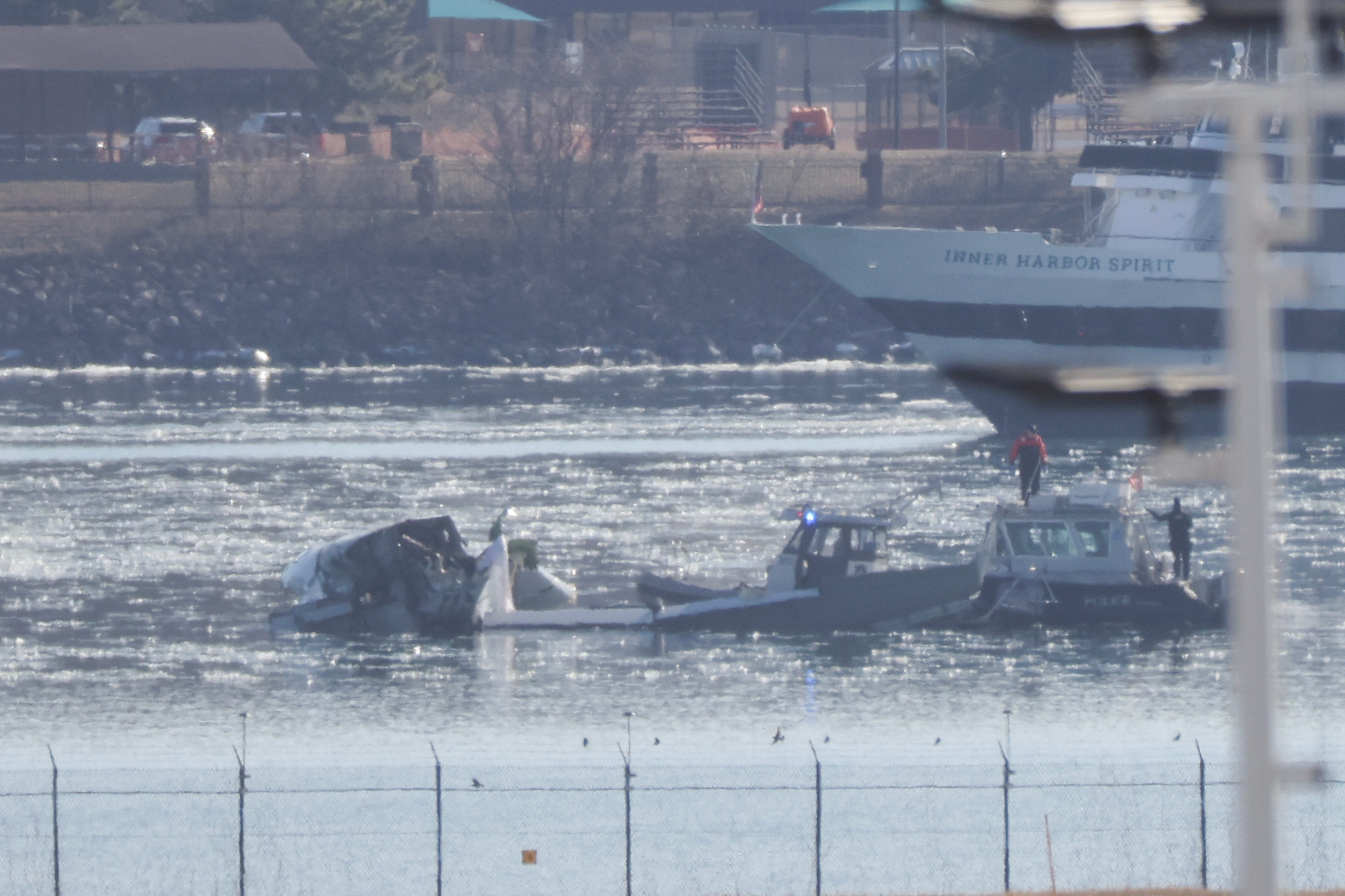 Emergency response units search the crash site of an American Airlines plane and Army helicopter on the Potomac River after the plane crashed on approach to Reagan National Airport on Jan. 30, 2025, in Arlington, Virginia.