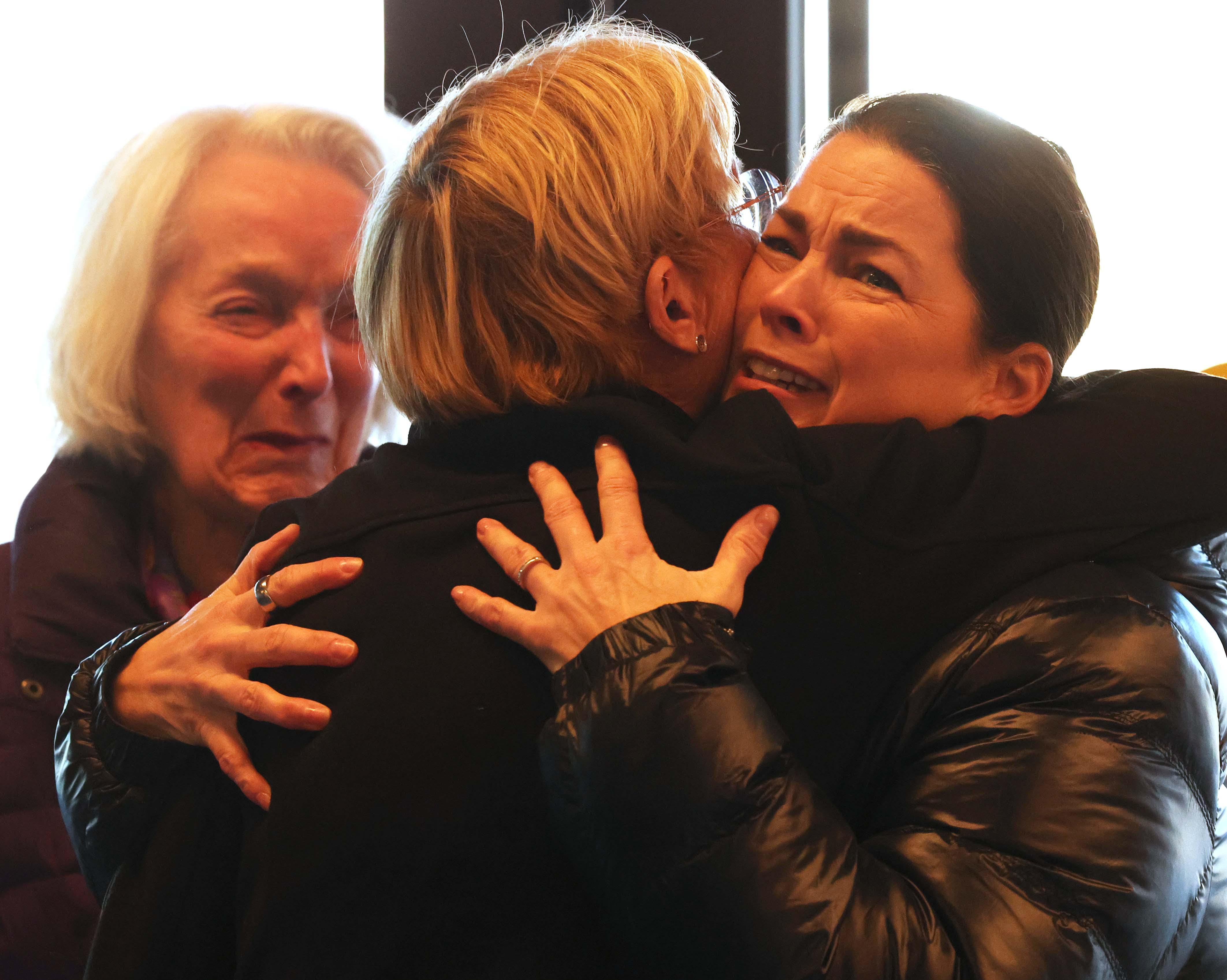 Nancy Kerrigan gets a hug from a Skating Club of Boston employee. To the left is Dr. Tenley E. Albright.